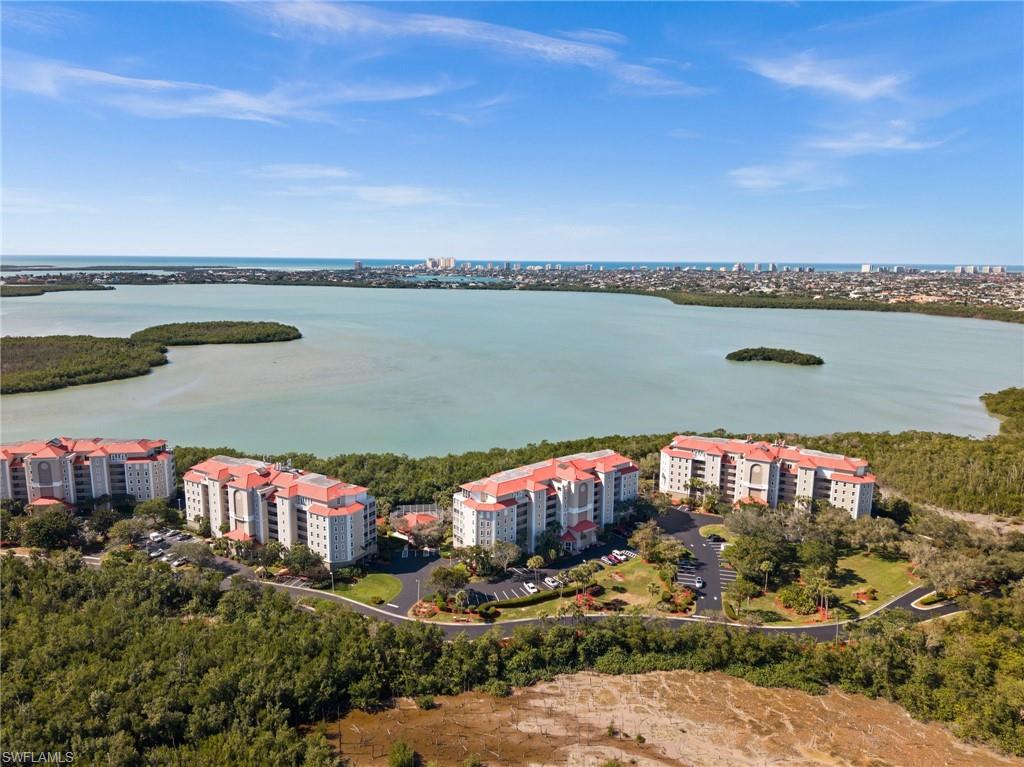 Welcome to 201 Vintage Bay Drive where serene waterfront living meets effortless comfort in one of Marco Island’s most peaceful gated communities. Perched on the 4th floor, this beautifully updated 3-bedroom, 2-bath residence offers sweeping, unobstructed views of Barfield Bay over the lush native mangroves. From the moment you enter, the high ceilings and expansive layout create a light, airy feel more like a private home in the sky than a typical condo. The heart of the home is a thoughtfully remodeled kitchen (2022), complemented by modern upgrades throughout, including a new AC (2022), washer (2024), and brand-new impact windows and sliders (2024). Electric hurricane shutters on all windows and the spacious screened balcony provide both convenience and peace of mind. The oversized screened balcony is the true showpiece, your front-row seat to Marco Island’s natural beauty. Start your mornings with coffee as dolphins and manatees play and birds glide over the bay. Wind down each evening with stunning sunsets that paint the sky. Quiet, private, and surrounded by nature, this is a space you’ll never want to leave. The primary suite and guest bedrooms are generously sized, offering comfort and flexibility for family and visitors. Additional features include two private storage lockers in the under-building garage, wide open hallways, and a secure building with keypad access.
Residents enjoy a friendly, welcoming atmosphere in a well-maintained gated community that allows pets (one up to 25 lbs or two totaling 30 lbs) and flexible rental opportunities (minimum 30 days, up to 12 times per year).
If you’ve been searching for peaceful waterfront views, modern updates, and a true sense of retreat—this is it.