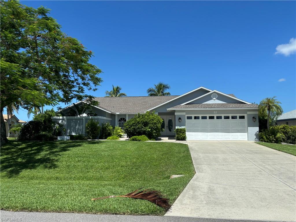 Welcome to 22 SE 10th Ave where you can soak in Florida sunsets right from your backyard on Shamrock Lakes. This 3-bedroom, 2-bathroom home features a heated pool and has a strong history as a successful vacation rental. Making it an excellent investment opportunity or personal retreat. 

Designed with a split floor plan, the home offers a private primary suite, while two additional bedrooms and a guest bath are situated on the opposite side for added privacy. The spacious family room opens to an enclosed patio, perfect for relaxing or entertaining.

Situated on a large corner lot, the property includes a two-car garage and access to freshwater boating across multiple lakes. Conveniently located near Fort Myers, you'll enjoy easy access to shopping, dining, golf courses, and beautiful Gulf beaches. 

Recent upgrades include a new shingle roof and irrigation system (2023), adding peace of mind for years to come.

Perfect as a year-round residence, winter getaway, or income-producing vacation home!