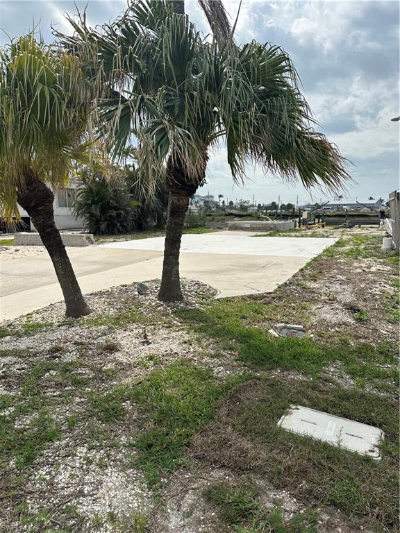 Be part of the revitalizatioon of Fort Myers Beach on San Carlos Island. This fabulous deep water lot with gulf access and no bridges to Estero Bay and the Gulf. Seawall redone in last five years.  Lot cleared an ready for your new home.  Builder introductions available. New development planned directly behind to include a New Marina, condos/hotel and more....jump on the Key West express or dine at Parrot Key.  Walk or bike right over the bridge to Fort Myers Beach downtown area and Margaritaville. Great location.