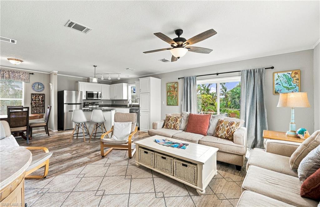 MOVE-IN READY & BUILT IN 2023! Welcome to this beautifully maintained 3-bedroom, 2-bath manufactured home in Pine Island Villas in Bokeelia, offering modern comfort with the relaxed island lifestyle you’ve been looking for! The bright, open-concept floor plan features a spacious living area with abundant natural light and attractive flooring throughout. The stylish kitchen is designed for both everyday living and entertaining, featuring white cabinetry, granite countertops, stainless steel appliances, generous storage and a large center island with seating.

The open living and dining areas create an inviting space for gathering with family and friends, while the split-bedroom layout provides plenty of room for guests, a home office, or hobbies. Built in 2023, this newer home offers the advantage of contemporary finishes and construction without the wait of building new. Outside, enjoy the Florida sunshine and the laid-back atmosphere that makes Bokeelia and Pine Island such a special place to call home. Whether you're searching for a full-time residence, seasonal Florida getaway, or island retreat, this attractive 3-bedroom home is ready for its next owner. Come experience the easygoing Pine Island lifestyle!