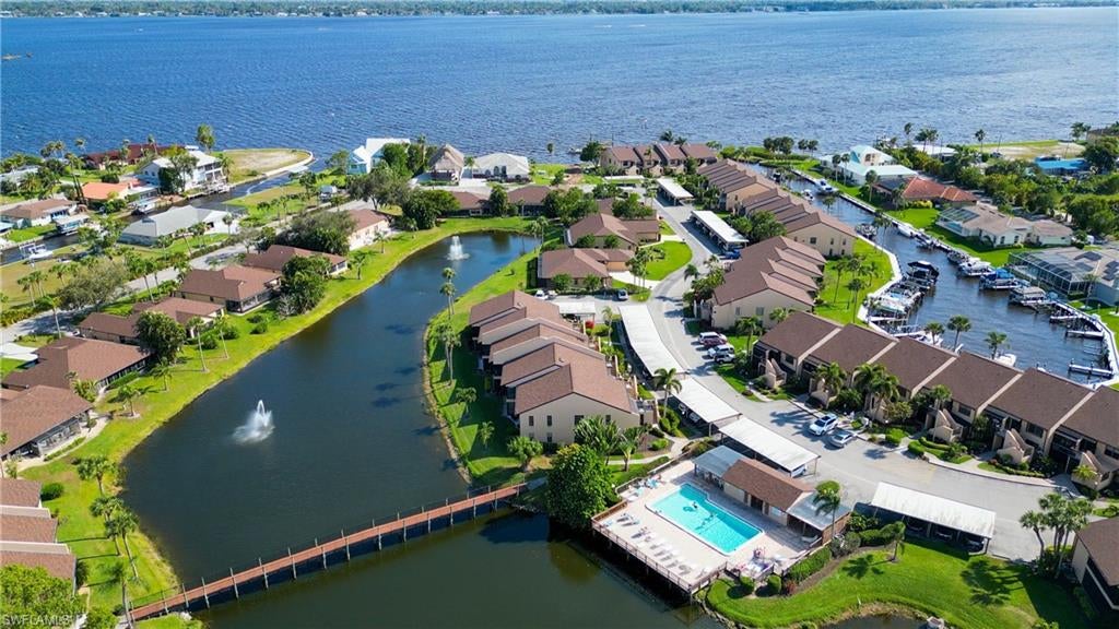 FIRST FLOOR ! GULF ACCESS CONDO Located in the BOATING COMMUNITY OF ADMIRALTY YACHT CLUB, located directly on the Caloosahatchee River. UPDATED 2/2  Condo has 2 boat docks with a lift and extra space for a jet ski, walk right out your back door to your boat just steps away. This charming condo has been completely updated, new kitchen cabinets, Granite countertops, stainless steel appliances, A/C, water heater, tile flooring. The large family/dining room overlooks the yacht basin with spectacular water views and screened lanai. Master suite is spacious w/ walking closet and sliding glass door to Lanai. The condo has two storage units, covered parking.
The amenities include heated pool w/ sundeck, tennis and pickleball courts, clubhouse, tiki style fishing pier. 
Enjoy convenient access to shopping, restaurants, and downtown Fort Myers. Ideally located 10 minutes to 1-75, 25 minutes to South West International Airport & Punta Gorda Airport. Come and see for yourself you will not be disappointed.