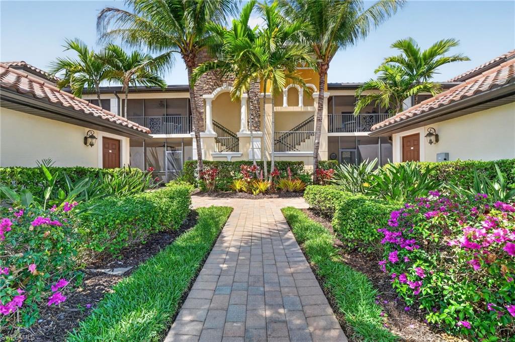 Welcome to an exceptional opportunity to experience resort-style living in the prestigious community of Treviso Bay, where every day feels like a private escape. This beautifully upgraded first-floor veranda with a coveted social membership offers serene water views, coastal charm, and amenities that dazzle. Inside, the residence brings understated elegance with warm designer tones, classic wainscoting, and thoughtfully curated finishes throughout. The bright, coastal-inspired kitchen showcases crisp white cabinetry, a view over the water, and a charming breakfast nook. The open-concept living area flows seamlessly to the screened lanai, where the soft natural light creates a peaceful, luxurious ambiance. The den is both functional and stylish, featuring a custom Murphy bed with illuminated cabinetry, ideal for hosting guests with ease. Life in Treviso Bay is defined by its world-class amenities centered around the renowned Club Rilassare, an indulgent, resort-style oasis featuring a lagoon pool, spa, poolside dining and bar service, state-of-the-art fitness center, and a full-service luxury spa. Residents enjoy an active yet refined lifestyle with tennis, pickleball, bocce, and beautifully maintained grounds designed for both recreation and relaxation. The elegant main clubhouse offers upscale indoor and outdoor dining, social spaces, and a vibrant calendar of events, while the private TPC Treviso Bay course provides seasonal access for social members. Perfectly positioned just minutes from the world-class dining, shopping, and culture of Fifth Avenue, the white-sand Gulf beaches, and Marco Island, this residence delivers the ultimate blend of luxury, leisure, and location.