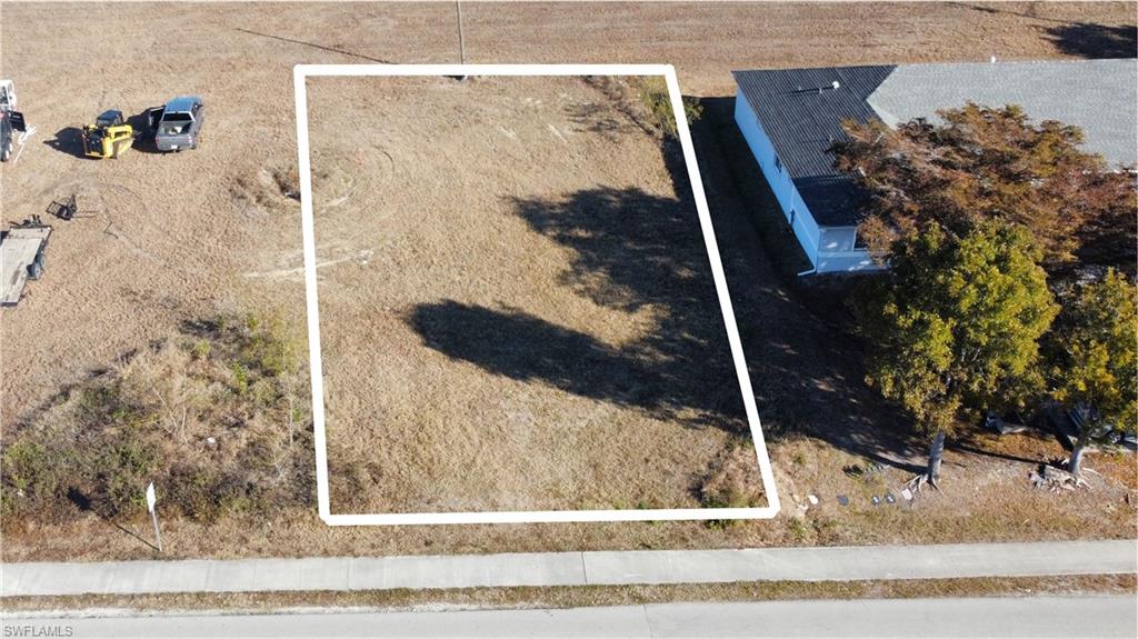 COMMERCIAL LOT - PROFESSIONAL OFFICE ZONED with city approved plans and impact fees paid. 

This lot is NOT IN A FLOOD ZONE and already has CITY WATER, SEWER AND IRRIGATION WITH ASSESSMENTS PAID IN FULL per Erin at the City of Cape Coral. 

 Drive by today and make your offer!