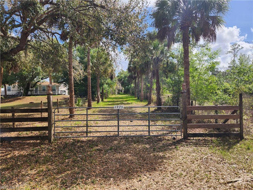 Build your dream home on this beautiful 2.8-acre rural residential property in the Beautiful and historical Ft. Denaud Florida. This property is being offered on the market for the first time in over 30+ years.

Kept as a private retreat, this property surrounded by beautiful fully mature oaks is fully fenced and thoughtfully improved, featuring a small pond the property has drip irrigation throughout and a shale driveway with a convenient roundabout for easy access and parking. Electric is already available on the property, providing a great head start when you're ready to build. Fill is already in place for your future home and garage, helping save time and development costs.

With horses allowed and plenty of open space, this property is perfect for a custom home, small homestead, workshop, or outdoor lifestyle. The land offers flexibility for gardens, animals, recreational vehicles, or additional outbuildings, giving you the freedom to design the country lifestyle you’ve been looking for.

Enjoy the privacy and peaceful surroundings of rural living while still being just minutes from everyday conveniences such as Walmart and Tractor Supply for shopping, supplies, and essentials.

Conveniently located near the fast growing area of LaBelle and only a short drive to Fort Myers, you’ll also have easy access to dining, shopping, entertainment, and Southwest Florida’s beautiful Gulf Coast beaches.