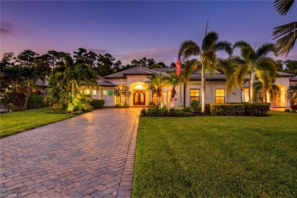 Discover exceptional indoor-outdoor living in this beautifully appointed WCI Laurel model, the largest floor plan available in LaMorada. Offering three bedrooms plus a den, four full bathrooms, and a spacious upstairs bonus room, this residence combines thoughtful upgrades, inviting entertaining spaces, and practical storm protection for an elevated Southwest Florida living experience. Entering through the elegant iron front entry door into the main living areas feature a recently upgraded kitchen with substantial quartz countertops, a gas range, and attractive cabinetry. Personalized touches in lighting, accent walls, and a custom-built entertainment center add unique touches throughout the interior, while the versatile floor plan offers plenty of room for everyday living, working from home, and hosting family and friends. Outdoor living takes center stage on the expansive covered lanai, where a distinctive wood-plank ceiling adds warmth and character. The resort-style heated saltwater pool & spa provide a relaxing backdrop, while the outdoor kitchen and TV make it easy to enjoy meals, watch a game, or spend time with guests. Hurricane shutters enclose the entire covered portion of the lanai, providing added protection when needed. Upstairs, the large bonus room offers exceptional flexibility, with a full wet bar, full bathroom, walk-in closet, and balcony. The generous space can accommodate a media area, billiards & game room, fitness space, or comfortable guest retreat. Additional features include a three-car garage, whole-home generator, tankless water heater, and impact windows & doors. With its versatile layout, luxury interior details, inviting outdoor living area, and practical protective features, this LaMorada home offers a highly desired combination of comfort, functionality, and entertaining potential.