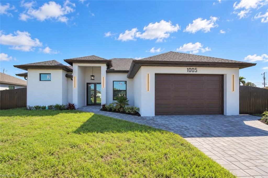 WELCOME TO YOUR PRIVATE CAPE CORAL OASIS! This stunning NEW CONSTRUCTION home combines modern design, high-end finishes, and exceptional indoor-outdoor living. Enjoy your private, fully fenced backyard featuring a beautiful freshwater pool with the option to convert to a saltwater, outdoor kitchen, and outdoor shower, creating the perfect space for entertaining or relaxing year-round.

Inside, the home offers a dedicated OFFICE plus 3 bedrooms,  spacious living areas, and a beautifully designed kitchen with upscale finishes. The laundry room comes complete with WASHER AND DRYER plus a utility sink, and the TV is also included with the property.
The primary suite is designed for comfort, featuring a luxurious bathroom with a separate walk-in shower and bathtub, double sinks, and two walk-in closets.
Additional features include IMPACT-RESISTANT WINDOWS AND DOORS, CITY WATER already connected, modern finishes throughout, and the peace of mind that comes with owning a brand new home.

From the pool and outdoor entertaining area to the thoughtful interior details, this property was designed to feel like your own private oasis.
Exceptional features at an excellent price. Don’t miss this opportunity. SCHEDULE YOUR SHOWING TODAY!