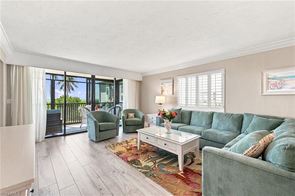Here's your opportunity to own a slice of paradise at the coveted Sanibel Gulf-front community of Compass Point! This corner/end unit has unbelievable beach and gulf views that dreams are made of. The floor to ceiling sliders allow you to enjoy the serene gulf waters and swaying palms when you wake up in the primary bedroom, while relaxing in the living room, making breakfast in the kitchen, or dining on the lanai! The screened and glass enclosed lanai spans the entire width of the unit, with spiral staircase that goes directly down to private cabana. This unique setup gives you extra (air conditioned) space (307 additional SF) for entertaining, with additional studio-type space with 3/4 bath, wet bar, and direct beach access. The cabana space also provides plenty of space to store your bikes and beach gear, right on ground level. From your cabana, head straight to the white sand on the newly built boardwalk. This unit has undergone recent updates, is furnished turnkey, and ready to call home. Compass Point allows weekly rentals, and this unit has had consistent, long-term rental history-- for those who may want extra income while not occupying the unit themselves. Heated pool and pool house updated, along with new tennis and pickleball courts, gas grills, and bocce court. Don't wait another minute to create memories in your beautiful Sanibel beach condo!