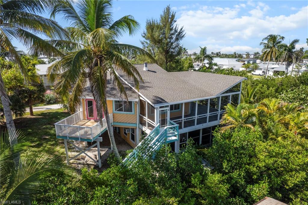 Welcome to 3660 Schooner LN in St. James City on Pine Island - a rare island-paradise where deep water, direct-Gulf access meets old Florida charm. With approximately 240 ft of waterfront, THE ENTIRE CORNER! dual boat docks with a lift, One of the docks will need a complete rebuild. Ample outdoor space on a generous 0.36-acre lot, this THREE Bedroom stilt home is built for adventure and relaxation alike. Additional living - STUDIO APPT with full kitchen on main level 509 sqft. with private lanai. Perfect for guest or AIRBNB! From Seasonal guest to Tarpon fisherman this could book almost year round! The elevated build lends timeless appeal and welcomes cooling gulf breezes as you enjoy your favorite beverage on the lanai. From here, you're minutes by boat to the open waters of Pine Island Sound and the Gulf; Just minutes to Sanibel and Captiva's famed beaches. Whether you're boating, fishing, beaching or simply soaking in the sunset, this is Island living at it's finest. Come live the good life - Bring your boat & Golf cart. This is what you have been waiting for. Short golf cart ride or walk to an Island favorite restaurant.