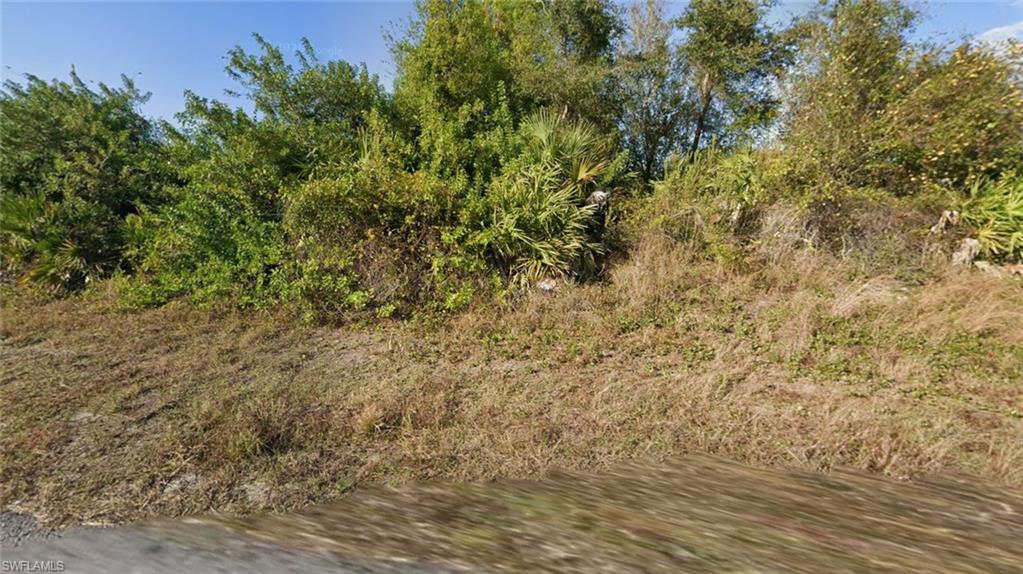 Start building equity by purchasing this land, with the option to later build a new construction home; qualifying buyers may be pre-qualified for financing, with potential mortgage rate buydowns or seller concessions—our mission is to help make you a homeowner. Rare half-acre double lot sold as one parcel, perfect for a builder to split and build two homes or for an end user seeking a private estate, with a half-acre neighbor to the east so you keep your breathing room. Discover an excellent opportunity to own approximately 0.50 acres of land consisting of two lots with paved roads and power available. This spacious half-acre property offers plenty of room to design and build, providing more flexibility than a typical quarter-acre lot. Located in an established residential area of Lehigh Acres, the property is surrounded by existing homes and additional residential lots, creating a growing neighborhood setting. Nearby 33rd Street SW and surrounding roads provide access throughout the community, while major local roadways connect residents to shopping, dining, schools, parks, medical services, and everyday conveniences throughout Lehigh Acres and the greater Fort Myers area.
