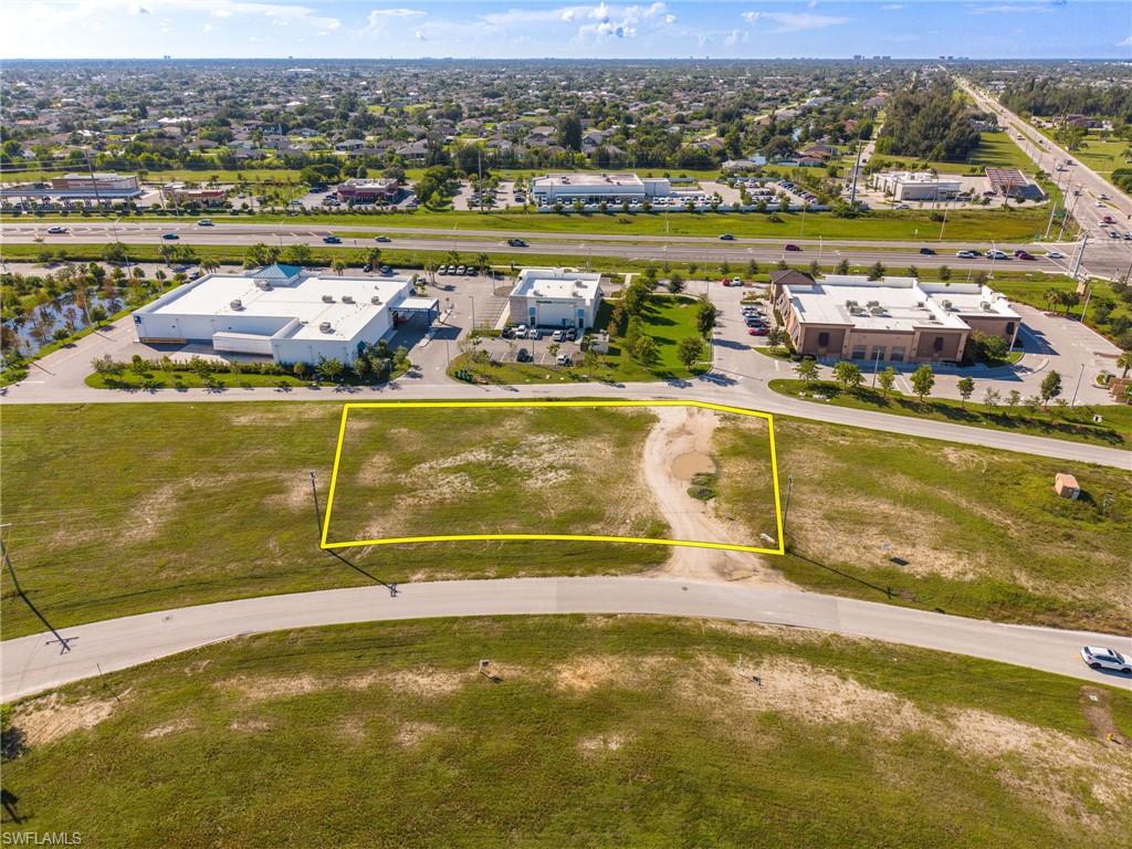 **PRIME COMMERCIAL DEVELOPMENT OPPORTUNITY ZONED CC RIGHT OFF THE PINE ISLAND ROAD CORRIDOR!** Strategically positioned just off Pine Island Road and Chiquita Blvd, this property offers convenient access to one of the city’s primary commercial corridors and is surrounded by continued residential and commercial growth. The Pine Island Road corridor has become a major focus for development in Cape Coral, with new retail, restaurants, medical, hospitality, multifamily and mixed-use projects continuing to reshape the area. Farmer Joes, Aldi and ABC Liquors are all shadow-anchored retailers. Just on the other side of Chiquita and Pine Island Rd, Cape Coral Grove, a planned approximately 131-acre mixed-use development is poised to become the most significant commercial development in the city’s history. This lot is being sold along with MLS #2026039009 creating an excellent opportunity to secure two adjoining commercial parcels that total 1 acre in one of Cape Coral’s most active and rapidly developing areas!