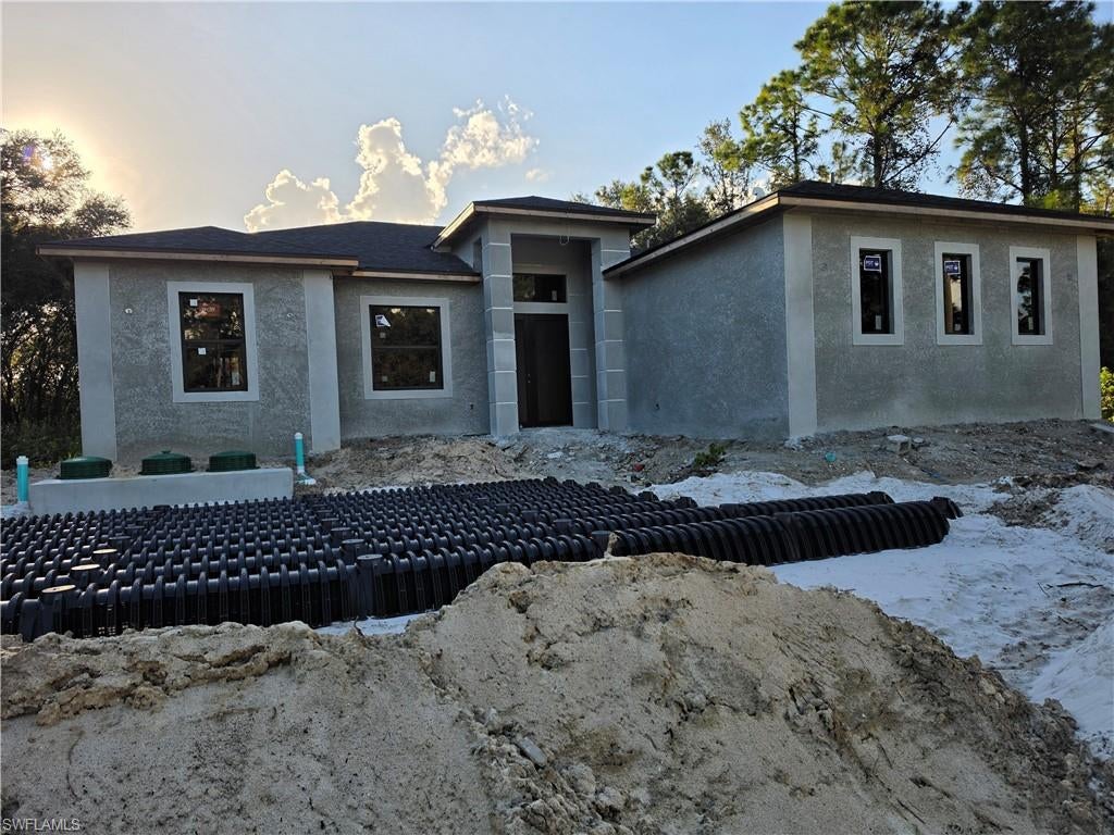 NEW CONSTRUCTION OPPORTUNITY IN A GROWING LEHIGH ACRES AREA! Motivated seller! This beautiful property offers a modern design, spacious layout, and excellent potential for comfortable living and future investment. The main home features 3 bedrooms, 2.5 bathrooms, and an open-concept floor plan designed for modern living and entertaining. A standout feature is the modern in-law suite, providing additional flexibility for extended family, guests, or potential rental use.

Enjoy Florida outdoor living with an exterior terrace featuring an outdoor kitchen, perfect for entertaining and gatherings. Situated on approximately half an acre, the property offers plenty of space and the potential to create your own private pool area and outdoor oasis. Located in an excellent and growing area of Lehigh Acres, this property combines new construction, functional design, spacious land, and future potential. Don't miss the opportunity to make this exceptional property your new home or investment!
