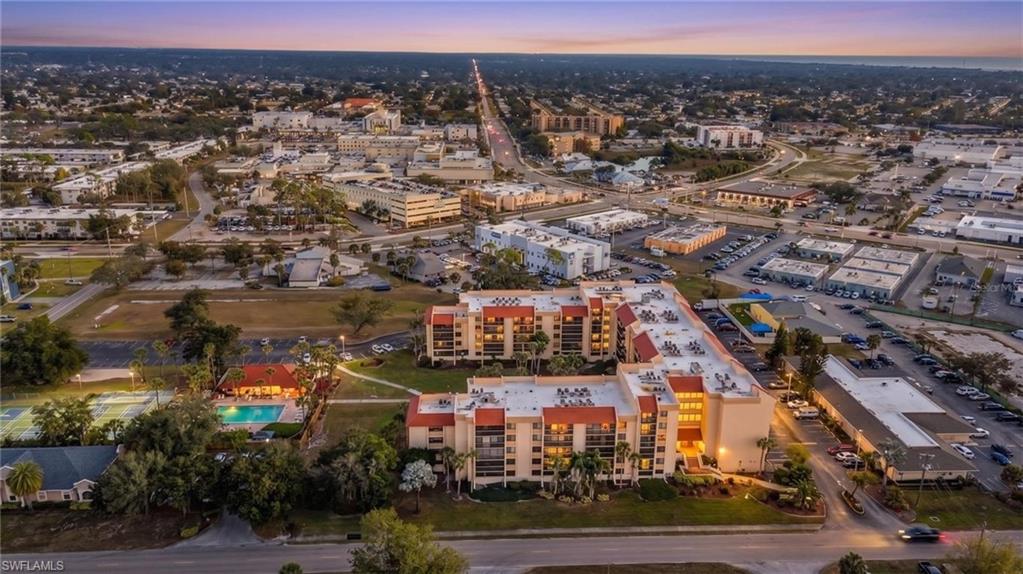 WELCOME TO PROMENADES WEST! Discover comfortable Florida living in this beautifully updated TOP-FLOOR, 2-BEDROOM, 2-BATH CONDO ideally situated on the sixth floor in the heart of Port Charlotte. Offering a combination of comfort, convenience, and desirable community amenities, this inviting residence also includes a DEDICATED UNDER-BUILDING GARAGE PARKING SPACE with convenient elevator access. Step inside to a bright, open floor plan designed for easy everyday living and entertaining. The spacious living area extends to a PRIVATE SCREENED LANAI, where you can relax and enjoy peaceful views overlooking the beautifully landscaped courtyard, heated swimming pool, and well-maintained pickleball courts. The primary suite offers a generous walk-in closet and private ensuite bathroom featuring a walk-in shower. A comfortable guest bedroom provides ample closet space, while a second full bathroom offers added convenience for visitors. RECENT IMPROVEMENTS INCLUDE A NEW FURNACE, CENTRAL AIR CONDITIONING SYSTEM, AND HOT WATER TANK, providing added comfort and peace of mind. Additional conveniences include all-electric utilities, a nearby garbage chute, and a well-maintained building with easy elevator access. Residents of Promenades West enjoy a welcoming community atmosphere with an array of amenities, including a HEATED SWIMMING POOL, PICKLEBALL COURTS, SHUFFLEBOARD COURTS, COMMUNITY GARDEN, AND ORGANIZED SOCIAL ACTIVITIES. Whether enjoying a relaxing afternoon by the pool, staying active, or connecting with neighbors, there are plenty of opportunities to embrace the Florida lifestyle. Conveniently located in the heart of Port Charlotte, this condo offers easy access to shopping, dining, medical facilities, and everyday conveniences. Perfect as a full-time residence, seasonal retreat, or investment opportunity, this top-floor unit offers an appealing combination of location, low-maintenance living, and community amenities. ADDITIONAL INVESTMENT OPPORTUNITY! The seller is also offering another top-floor condo in Promenades West (MLS# 2026042917), providing a unique opportunity to purchase two units within the same desirable community. Don't miss your chance to enjoy the best of Florida condo living!