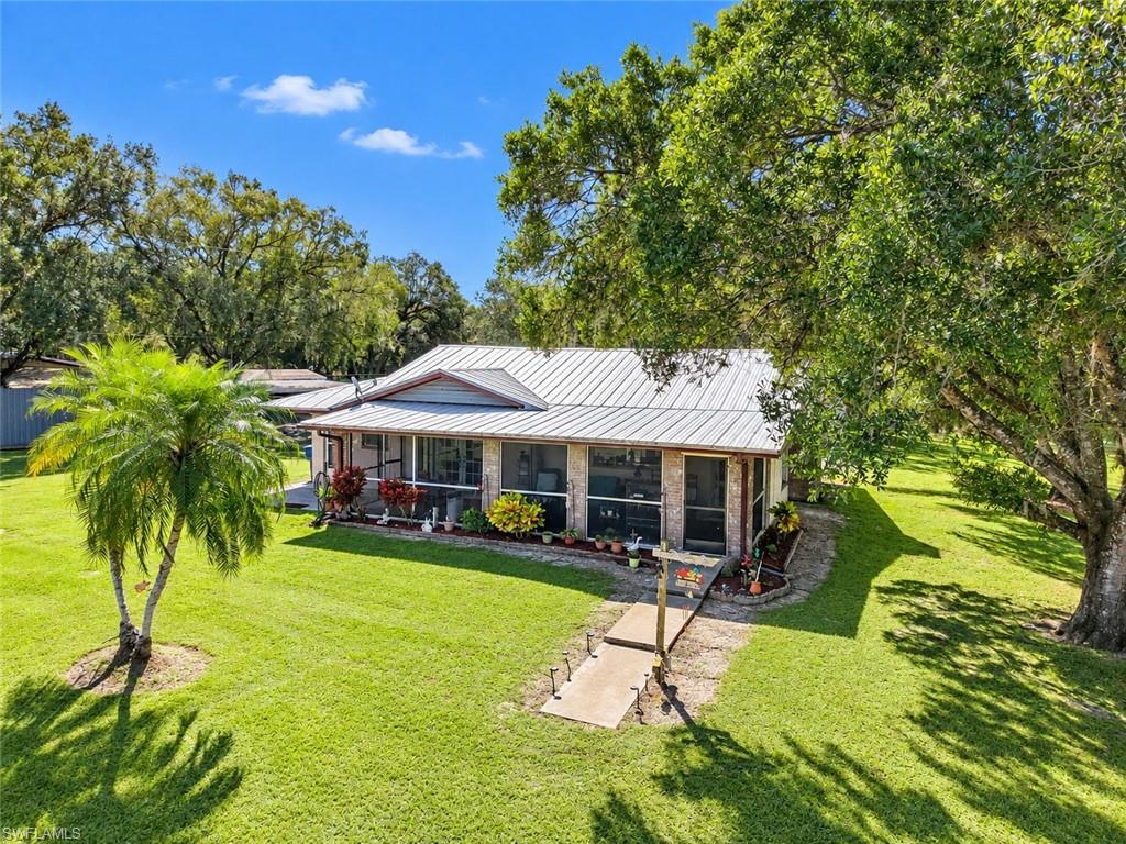 Sellers are looking for offers!

4.5 Acres • Private Lake • Multiple Structures • Endless Possibilities!
Enjoy the privacy of this scenic, tree-covered 4.5-acre property, including a portion of a private lake shared with only one other neighbor. The 1980 concrete-block main home features a metal roof, screened front porch spanning the entire front, and a huge rear patio. Inside are oversized living/family and dining areas, a separate kitchen, two bedrooms, two bathrooms, a wood-burning fireplace, and a separate laundry/pantry. There is room to create a third bedroom if desired.
The property also includes a 1,200+/- SF 2-bedroom/1-bath mobile home with a large private screened porch, ideal for guests, extended family, or rental use. An additional small handicap-equipped mobile home provides flexible space for an office, homeschooling, hobby room, or studio.
Two exceptionally well-built pole-barn/garage outbuildings provide abundant storage and workspace for vehicles, equipment, recreational toys, or projects.
A rare combination of acreage, private lake frontage, multiple living spaces, mature trees, and versatile outbuildings. Bring your vision and your offers!