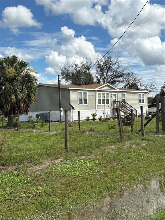 Almost-new, spacious mobile home situated on a beautiful 1.25-acre completely fenced property, offering plenty of room for hobby farming, animals, gardening, and outdoor enjoyment.

A large pond located in the center of the property adds to its charm and provides a great fishing opportunity, with an abundance of tilapia. Whether you’re looking to start a home-based business, create your own small hobby farm, or simply enjoy a peaceful home away from home, this property offers plenty of possibilities.

With its generous acreage, fenced grounds, spacious home, and private pond, this is a great opportunity for those looking for space, privacy, and a relaxed rural lifestyle.

Discover the possibilities and make this unique property your own!