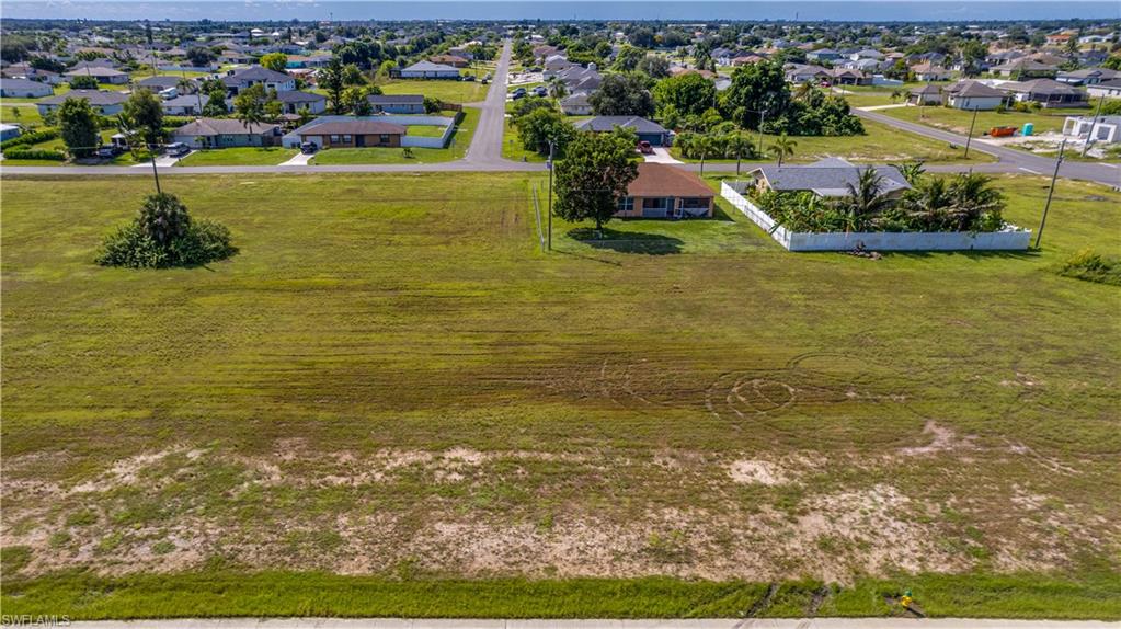 Incredible opportunity with zoning that allows a Single-Family home, Duplex, or Tri-Plex! ALL ASSESSMENTS PAID, NOT in a flood zone, and NO HOA. Situated in a friendly, fast-growing area of newer homes, this lot offers unbeatable convenience close to everything. Diplomat Elementary & Middle Schools are less than .5 miles away, and Pine Island Rd is just minutes away with endless shopping, dining, entertainment, fitness, and everyday services. Outdoor lovers will appreciate nearby Sunsplash and the Skate Park. Build your dream home or create a multi-unit income property—live in one unit and rent the others. A rare chance to secure a versatile homesite in one of Cape Coral’s most dynamic growth corridors! NOTE: the adjacent lot, 1316 Diplomat Pkwy E is also available with the same criteria.