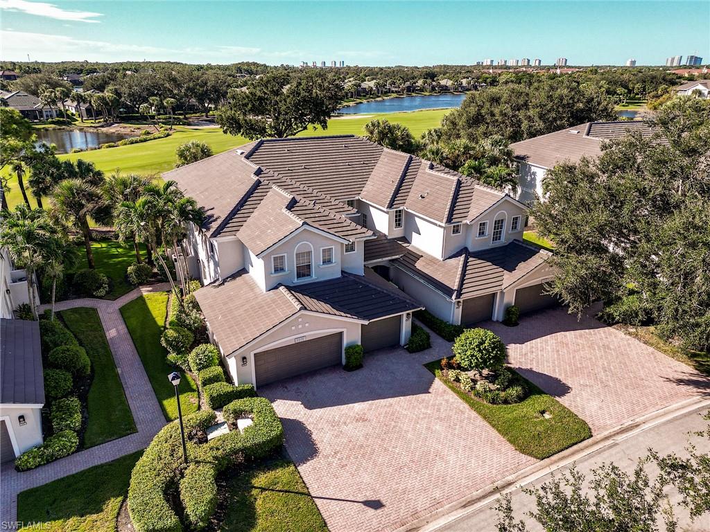 Enjoy the Southwest Florida lifestyle in Shadow Wood at The Brooks, a highly sought-after gated community in Estero. This beautifully remodeled 2 Bedroom + Den, 2 Full Bathroom, FIRST-FLOOR Coach Home features an attached 2-CAR GARAGE, coveted southern exposure, and beautiful golf course and lake views. The updated kitchen showcases white cabinetry, quartz countertops, a designer tile backsplash, and stainless steel appliances. Both bathrooms have been tastefully updated with quartz countertops and new cabinetry, while the spacious primary suite offers dual sinks, a separate tub and shower, and a walk-in closet. The versatile den offers the flexibility of a home office or additional sleeping space for overnight guests. Hurricane-impact exterior sliding glass doors allow the lanai to be enclosed or opened to the outdoors, offering year-round enjoyment and the ability to seamlessly connect the lanai with the air-conditioned living area while taking in the gorgeous golf course and lake views. Recent exterior upgrades include a new flat tile roof (2023), updated light fixtures, fresh exterior paint, and all-new landscaping. Every detail has been thoughtfully considered — this coach home is truly move-in ready and a MUST SEE! Experience the desirable country club lifestyle of Shadow Wood, with optional membership opportunities offering 54 holes of championship golf, two clubhouses, 8 Har-Tru tennis courts and bocce. Construction is underway of a $22.5 million Lifestyle Center, which will include a resort-style pool, poolside restaurant and bar, 6 indoor pickleball courts, and a grab-and-go café. The Commons Club (also optional membership) offers brand-new pickleball courts, a state-of-the-art fitness center, spa, additional restaurant, and access to a private beach club. Shadow Wood is conveniently located just minutes from the Coconut Point Mall with shopping and dining, and a short drive to the airport and area beaches.