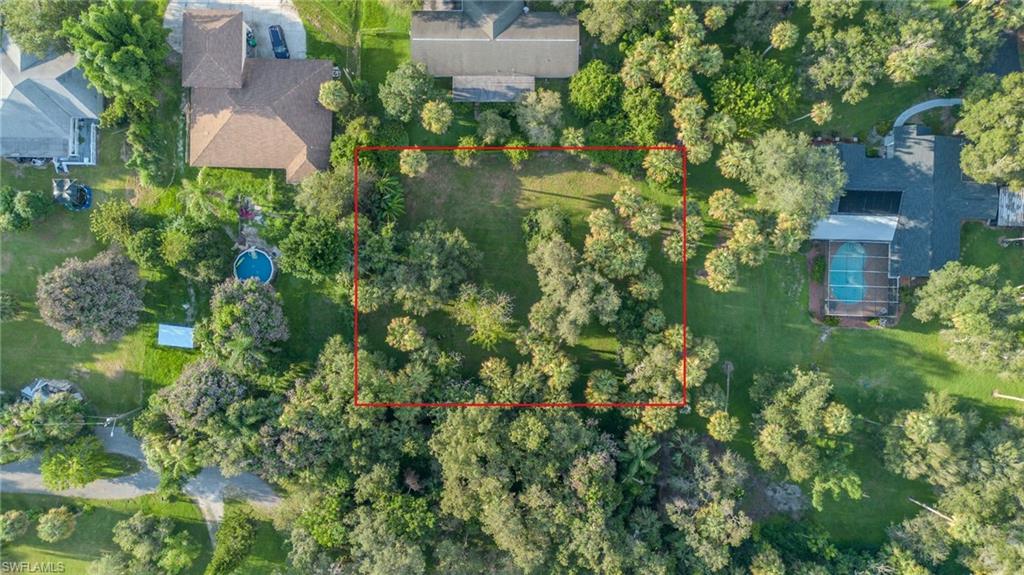 TUCKED-AWAY IN-TOWN HOMESITE WITH TROPICAL SETTING!
"A mature fruit producing loquat tree."
Discover the charm of this .399-acre homesite tucked away at the end of a tranquil street in the heart of LaBelle. Measuring approximately 146' x 130', this nearly square parcel is exceptionally spacious—nearly twice the size of a typical Port LaBelle homesite—providing plenty of room for your new home, outdoor living areas, gardens, and more. 
The property offers a peaceful, natural setting with native vegetation, mature tropical landscaping, producing banana trees, and an abundance of bird activity. The homesite is high and dry and appears to be located in Flood Zone X, offering the potential advantage of not requiring flood insurance; buyers should verify flood-zone designation and insurance requirements with their lender and appropriate authorities.
City water lines are already in place for connection, and a city sewer project is currently underway that is expected to extend sewer service to this area. This combination of a large homesite, in-town location, available utilities, and a quiet natural setting makes this a rare opportunity to build your home in LaBelle.
LaBelle offers the best of both worlds—a quiet, small-town lifestyle with convenient access to Southwest Florida's larger cities. For those seeking less noise and traffic, a slower pace, and a friendly community atmosphere, LaBelle is an ideal place to call home. Conveniently located approximately 30 minutes from downtown Fort Myers and North Fort Myers, about 2½ hours from Miami, and approximately 3 hours from Orlando, LaBelle is centrally positioned for work, recreation, and travel throughout Florida.
If you've been searching for a larger in-town homesite with character, privacy, mature tropical vegetation, and convenient access to city amenities, take a look at 780 Washington Avenue!