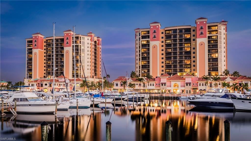 Luxury Penthouse Residence on the 14th Floor with Spectacular Marina & Sunset Views! Welcome to this beautifully updated 2-bedroom, 2-bath residence in Cape Harbour, one of Southwest Florida's premier waterfront and boating communities. Perched on the 14th floor, this exceptional home offers breathtaking panoramic marina views by day and unforgettable sunset vistas over the water each evening.

Designed for both comfort and style, the open-concept floor plan is enhanced by numerous recent upgrades, making this residence truly move-in ready. The kitchen features new granite countertops (2025), complemented by a new dishwasher (2025) and refrigerator (2023). Additional improvements include a guest bathroom remodel (2023), new bedroom carpeting (2022), washer and dryer (2024), HVAC (2018), water heater (2016), new LED recessed lighting (2025), interior paint (2021/2022), updated door hardware, freshly painted exterior door frames, new lanai screens and painted screen frames (2024), and professionally cleaned, buffed, and sealed tile flooring (2026).

A rare and highly desirable feature, this residence includes two deeded reserved parking spaces in the gated, secure Level 3 parking garage—an exceptional convenience and added value within Cape Harbour.

Residents enjoy a true resort-style lifestyle with access to two heated pools, BBQ areas, a clubhouse, fitness center, tennis courts, and the vibrant Cape Harbour Marina, where waterfront restaurants, boutique shopping, live entertainment, and year-round events create an unmatched coastal lifestyle. Enjoy evenings at Fathoms Restaurant & Bar or Rumrunners, both just steps from your front door.

Whether you're searching for a full-time residence, seasonal retreat, or investment opportunity, this penthouse offers luxury waterfront living in one of Cape Coral's most sought-after destinations. For boat slips or dry storage availability, contact Safe Harbor Marina at Cape Harbour.

Clubhouse, fitness center, and second pool are conveniently located at 1720 El Dorado Parkway W.