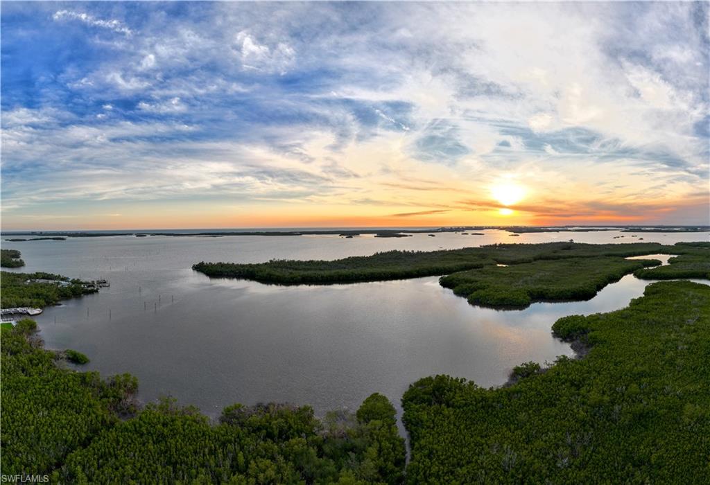 One or more photo(s) has been virtually staged, AI generated or rendered.  Discover The Ritz-Carlton Residences, Estero Bay — one of Southwest Florida's most prestigious luxury waterfront communities, nestled along the serene shores of Estero Bay with breathtaking, unobstructed views of the Gulf. Spanning 500 acres of pristine coastal land, this landmark development by London Bay Development Group offers an unparalleled opportunity to own a luxury condo in Estero Bay, Florida. Two iconic 22-story towers, each crowned by two exclusive penthouses, house 224 exquisitely appointed residences ranging from 2,628 to 3,885 square feet, with two-, three-, and four-bedroom plus den floor plans — making this one of the most sought-after luxury real estate opportunities on Florida's Gulf Coast. Residents of The Ritz-Carlton Residences Estero Bay enjoy world-class amenities including a sports simulator room, private theater, teen and kids club, luxury spa and beauty salon, and 24-hour concierge, bellman, and valet services. The state-of-the-art wellness center features premium fitness equipment, a yoga and Pilates studio, private training rooms, and locker rooms with steam and sauna — setting a new standard for luxury condo living in Southwest Florida. Beyond the towers, residents enjoy exclusive direct access to Saltleaf, Southwest Florida's newest and most exciting coastal village. This vibrant waterfront destination features a 72-boat slip marina, an 18-hole championship golf course, a 9-hole short course, tennis courts, pickleball, and Acqua Bistecca — an extraordinary waterfront dining experience by acclaimed Chef Michael Mina — all conveniently accessible within the community. Saltleaf coastal village redefines the Gulf Coast lifestyle, blending world-class recreation, celebrity chef dining, and marina living into one breathtaking waterfront address. The Sunset Lounge and private dining room provide sophisticated social spaces, while the Sports and News Café offers a daily continental breakfast included with every residence. The Ritz-Carlton Residences, Estero Bay at Saltleaf delivers an unmatched standard of living where world-class Ritz-Carlton service meets the natural beauty of coastal Florida.