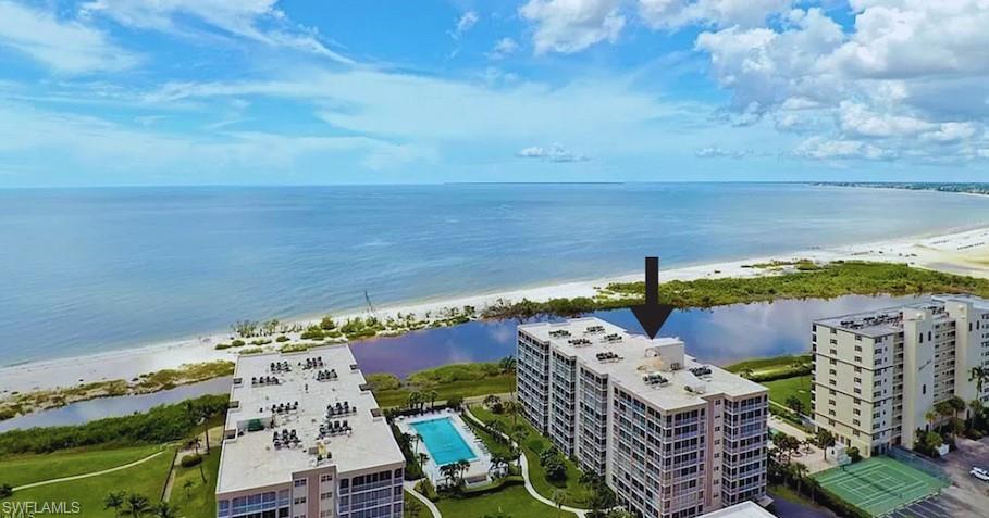 Picturesque Panoramic views of the Gulf of Mexico & White Sandy Beach from this Tommy Bahama-inspired turnkey-furnished beachfront condo! Magnificent Sunsets from the glass-enclosed terrace w/floor to ceiling sliders! Wht raised panel kitchen cabinets w/granite counters. Newer wht double door refrig, glass top range, dishwasher, microwave & W/D! Spacious greatrm & dining area w/endless views of the beach! Owners bdrm w/sliders to terrace, lg walk-in closet/built-ins & engineered wood floors. Ensuite bth w/vanity w/granite top/wht tile floor! Gt bdrm has a wht built-in desk & shelving w/Murphy Bed, sliders & wood floors! In-unit laundry rm. Assigned/deeded parking space & storage locker! Creciente is a 6.5-acre property on the quiet south end of beach w/one of the largest pools on FMB. Renovation of amenities in progress with unit occupancy hopefully by November of this year & Santini Plaza w/restaurants & shops! A full-service Marina across the street! Margaritaville Resort on the north end is reachable by car or trolley & almost completed but open for business! Easy access to Lovers Key, Bonita & Naples! Perfect primary or vacation home & w/12 rentals a year it is a great seasonal rental too! Pet-friendly building! Great time to buy!