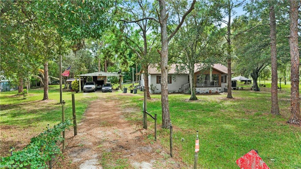 Welcome to country living in Montura Ranch Estates! Situated on approximately 1.19 fully fenced acres, this 3-bedroom, 2-bath home offers 1,290 square feet of living space with plenty of room to enjoy the outdoors. Inside, you’ll find a split-bedroom floor plan, vaulted ceilings, and comfortable living areas ready for your personal touch. Enjoy the front porch or relax on the screened rear porch while taking in the peaceful surroundings.

The spacious property offers plenty of room for your vehicles, recreational toys, animals, or outdoor activities and includes a detached covered carport and additional storage. Located on a corner lot along paved Woodland Boulevard, this property offers the space and flexibility that make Montura Ranch Estates so desirable. Enjoy country living while still being within convenient driving distance of Clewiston. Schedule your showing today!
