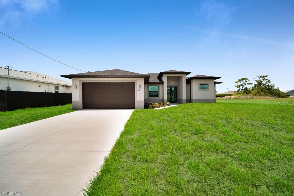 Price Improved! New construction in Cape Coral under $360K, located in a no flood zone with no HOA. This move-in ready 3-bedroom plus den, 2-bath home offers modern finishes, impact windows, an open floor plan, and an outdoor kitchen—an excellent opportunity for buyers looking for value, comfort, and flexibility. FHA, VA, conventional, and cash buyers are welcome.
The chef-inspired kitchen showcases solid wood cabinets, stainless steel Whirlpool appliances, quartz countertops, a modern sink, and garbage disposal. The luxurious bathrooms feature brushed nickel fixtures, tiled shower enclosures, and a freestanding tub in the primary bath.

Enjoy soaring coffered ceilings, energy-efficient impact and Low-E windows, LED lighting, ceiling fans, and a digital thermostat for year-round comfort.

The outdoor space is perfect for entertaining, featuring a spacious lanai and included an outdoor kitchen. Additional highlights include low-voltage pre-wiring for TV and internet.

A beautiful blend of modern design, comfort, and functionality in desirable Cape Coral!