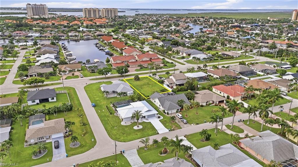 Build your Florida dream home in one of Cape Coral’s most desirable areas, just minutes from Tarpon Point Marina. This prime homesite puts waterfront dining, boutique shopping, live entertainment, parks, and the marina all within an easy golf cart ride. With city water and sewer available and all assessments paid, the property is ready for your vision. Enjoy a peaceful neighborhood setting with walkable streets while staying close to everything that makes Southwest Florida living special. Whether you’re planning a full-time residence, seasonal retreat, or future investment, this is an exceptional opportunity to own a homesite near Tarpon Point Marina and create the lifestyle you’ve been dreaming about.