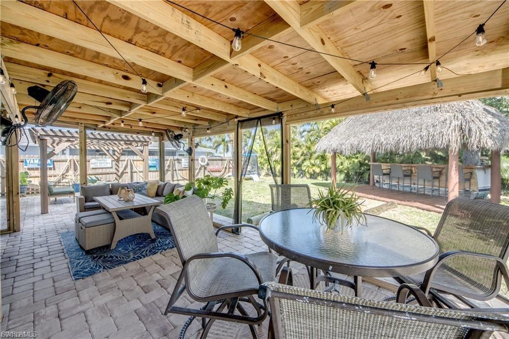 Welcome to your own slice of paradise on Fort Myers Beach.   This updated charming coastal home is full of
Island character and features a spacious fenced backyard complete with Tiki Hut, Boat Bar and plenty of
room to add a pool.  Very large screened in lanai for entertaining and relaxing.  Nestled on a quiet mid Island
street in the desirable Shell Mount Neighborhood with deeded beach access.  Home recently updated in 2023 including new roof, AC, electric and plumbing.  Home would be perfect for a seasonal retreat or rental.  Offers peace of mind while enjoying the relaxed coastal lifestyle Fort Myers Beach is known for.
