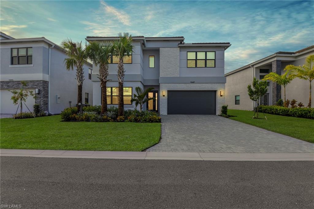 LUXURY FEATURES THROUGHOUT in this gated Rivercreek community! 100% Completely Customized 2-story GL Cascade model that offers UPGRADES that set this home apart from all others - 5 bedrooms, 7 full bathrooms, 2-car garage, 4435 sq ft under air, custom built bar, custom built entertainment center, custom built wine closet w/ glass door, custom wall accents, custom glass door on "collection closet" in primary bedroom, gorgeous high-end light fixtures & fans, quartz countertops throughout, gourmet kitchen w/ Bosch appliances, impact glass windows & doors, tile flooring throughout first floor, custom window treatments such as the draperies, silhouettes, duets as well as shades; designer grade cabinetry, and so much more. Located on one of the builder's premium lots that's on a quiet street near the end of a cul de sac. SEE ATTACHED FEATURE SHEET RiverCreek, a natural gas community, offers an abundance of amenities for the entire family to enjoy. With a sprawling 12,000 sq ft clubhouse featuring an indoor sports complex, a resort-style pool, a fitness center/exercise studio, an event room, a catering kitchen, a card salon, a sports lounge, a fire pit, a playground, a splash park, indoor & outdoor basketball, and lighted courts for pickleball, tennis, and bocce. There's something for everyone across the community. Located off the Corkscrew Road corridor just east of I-75, giving you easy access to FGCU, Coconut Point, Hertz Arena, Gulf Coast Top Golf, Town Center, & Miromar Outlets. Plus, you will be just a short drive to championship golf courses, community parks, and the beaches that line the shore of the Gulf Coast. SEE Virtual Tour link for full Video Walk Thru.