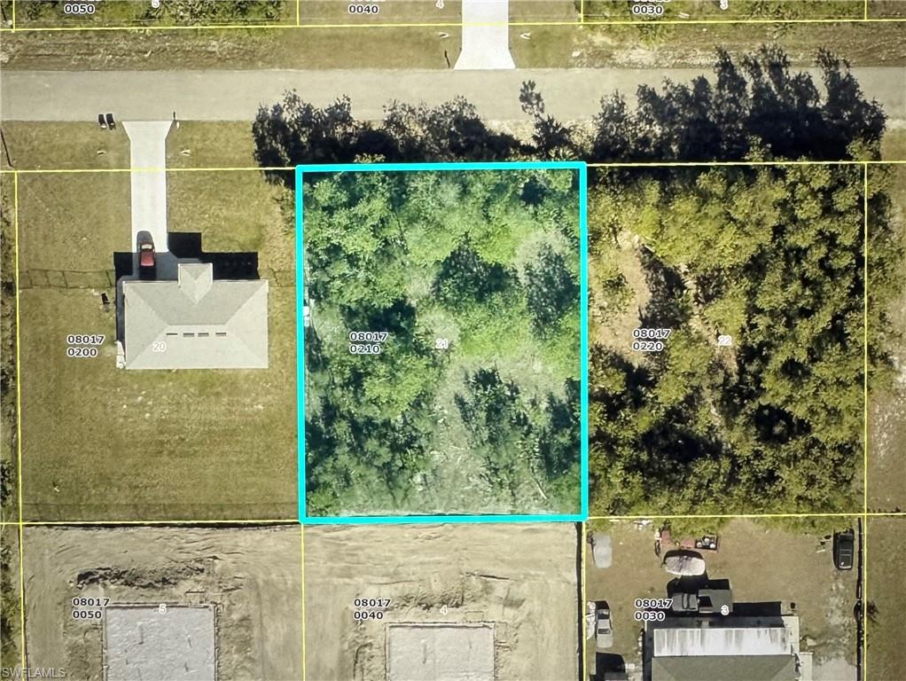Discover the perfect place to build your dream home on this oversized 0.29-acre homesite! Situated on a paved road with power available, this spacious lot offers an excellent opportunity for homeowners, investors, or builders. NO FLOOD ZONE! Located in a growing area of Lehigh Acres, you'll enjoy convenient access to schools, parks, shopping, restaurants, medical facilities, and major roadways, with easy connections to Fort Myers, RSW  International Airport, without mentioning its gorgeous sandy beaches! Whether you're looking to build now or invest for the future, this oversized parcel combines location, convenience, and development potential in one outstanding property. Don't miss this chance to own land in one of Southwest Florida's fastest-growing communities!