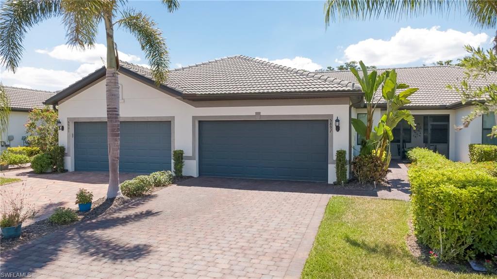 ***SHORTSALE OPPORTUNITY*** Welcome to this beautifully maintained SEAGROVE floor plan villa in the highly sought-after 55+ community of DEL WEBB NAPLES in Ave Maria. Offering 2 bedrooms + den, 2 baths, a 2-car garage, and 1,460 sqft, this home combines comfort, convenience, and peaceful preserve living.

The interior is TILED THROUGHOUT and feels LIKE NEW, with PARTIAL FURNISHINGS included to help make your move easier. The thoughtfully designed kitchen features WHITE CABINETS, while both bathrooms offer SHOWERS for ease and functionality. IMPACT WINDOWS AND DOORS provide added peace of mind, while the GLASS FRONT DOOR and PLANTATION SHUTTERS enhance the home’s welcoming character and finished appearance. A SINK IN THE GARAGE adds extra convenience.

Enjoy Florida living from both the SCREENED-IN FRONT PORCH and the EXTENDED SCREENED LANAI overlooking a tranquil PRESERVE VIEW with GORGEOUS SUNSETS in the evening.

Del Webb Naples offers access to TWO CLUBHOUSES and an impressive selection of AMENITIES, including a golf simulator, tennis, pickleball, bocceball, pool billiards, darts, a resort-style beach-entry pool with infinity-edge views, lap lanes, fitness center, library, and multiple club rooms. A full-time lifestyle director organizes numerous activities, clubs, and events throughout the year.

Ave Maria is nationally recognized as a Blue Zone® and one of the top master-planned communities in the United States, offering shopping, dining, parks, trails, and a vibrant town center.

Ave Maria: where community meets paradise.