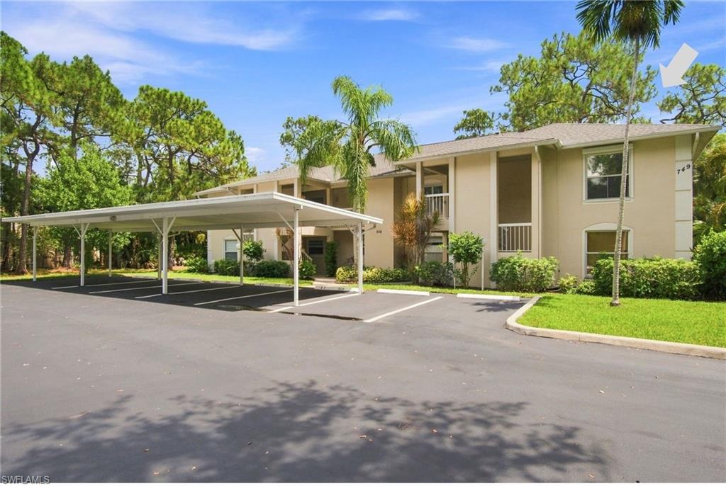 Over 1,400 sqft in this spacious 3 bedroom, 2 bathroom condo on the 2nd floor in Berkshire Lakes in Naples! This unit features a brand new AC unit, 2 year old hot water heater, hurricane shutters throughout, 1 assigned carport and a screened lanai overlooking a peaceful and private wooded area! Conveniently situated just minutes to I-75 and less than 30 to beautiful beaches like Lowdermilk Park and RSW for easy travel. This condo offers both comfort and accessibility for SWFL living!! All big ticket items have been updated with this one, plus a 6 month HomeTech warranty on all appliances, plumbing and electrical will convey and new piping was done throughout the unit. New Castle residents enjoy community pools, a clubhouse, tennis and pickleball courts, a fishing pier, and jogging and biking paths around beautiful lakes! This condo is ideal as a full-time residence or seasonal retreat with only a 30 day minimum for leases and 4 leases per year allowed.