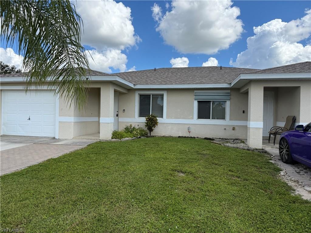 This wonderful duplex can be yours if you act now! Located in the bustling North Cape near Del Prado and Pine Island Road, this property is convenient to everything. No Flood insurance required!  Each side features 3+2 with an attached single garage and a screened porch. The floor plan provides high ceilings in the living area which is open to the large kitchen. There is a pantry and a good amount of storage inside. The main bedroom is at the rear of the home and features an attached bathroom. There is no carpeting, either laminate or tile throughout. Each side has a private screened patio.  The 1221 side has been freshly painted and is ready for immediate occupancy. The 1219 side has a tenant that will be vacating at the end of the month. This is an ideal set up for an owner occupant needing both sides. The roof was replaced in 2024, and both AC units have been updated since built. The buyer is to assume the balance of the utility assessment which is on the tax bill. Professional photos coming soon.