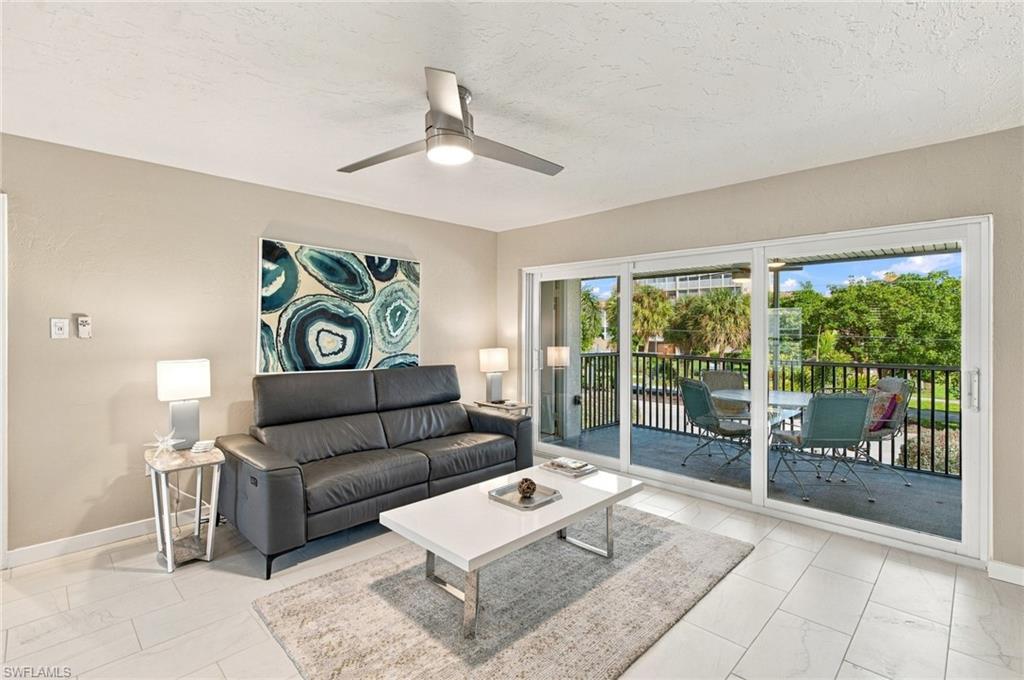 Set right on the Gulf at the south end of Marco Island, Surfside Club puts the water’s edge at the end of a short, palm-lined stroll from your door. Inside the gates, just 50 residences surround a broad central lawn, giving the community a quiet, unhurried pace. Refreshed in January 2026 with new porcelain tile, paint and trim, giving every room a bright, breezy feel. New ceiling fans keep the air moving, and a wide three-panel slider fills the living room with natural light. Mornings start with coffee on the screened lanai, framed by palms and treetops, and the same spot makes an easy place to unwind as the day winds down. Cook in a kitchen of custom wood cabinetry with glass-front uppers, granite counters and stainless appliances. The split-bedroom layout keeps the master bedroom a quiet retreat, with a built-in media wall and a barn-door entry to a bath with a frameless glass shower, granite dual vanity and linen towers. The second bedroom sits on the opposite side, giving guests their own space. An assigned parking space and a separate storage area handle the practical side of coastal living. Outside, the day is yours to shape. Swim in the pool, soak in the spa, or settle in under the covered poolside pavilion. Fire up a grill on the lawn, cast a line from the fishing pier, or read in the shade of a waterfront chickee hut with the Gulf and Caxambas Pass stretching out before you. Loungers line the pavered waterfront deck, a natural spot to spend a long afternoon by the water. With South Beach within easy reach, Surfside Club offers a rare combination of island quiet and true coastal living.
