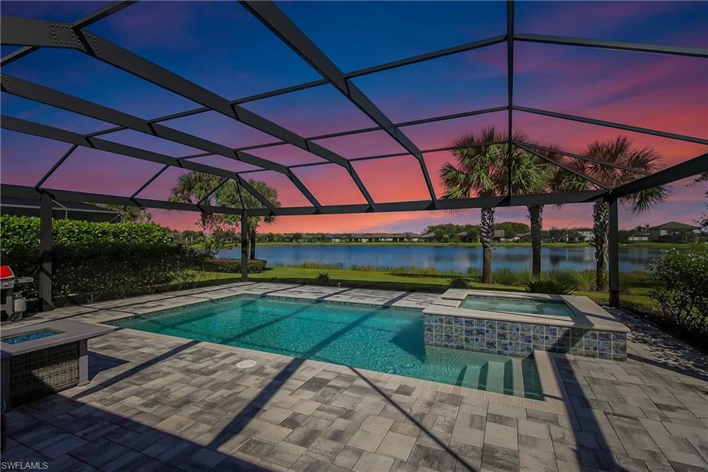 NORTHWEST LAKEFRONT VIEWS, CUSTOM POOL & SPA, WHOLE HOME GENERAC GENERATOR, ATTACHED ACCORDIAN HURRICANE SHUTTERS, STORM SMART HURRICANE SCREENS ON THE LANAI- this home is FULLY LOADED WITH HIGH END UPGRADES!!! Offering 3 BEDROOMS + DEN, 3 FULL BATHS, AND 2,032 SQFT of interior living space this stunning home blends the best of SW Florida living with peace of mind. Additional UPGRADES include TILE FLOORING THROUGHOUT, BOSCH KITCHEN APPLIANCES, SURROUND SOUND SPEAKER SYSTEM, CUSTOM WOOD PANTRY SHELVING, and a WHOLE HOME REVERSE OSMOSIS SYSTEM. The primary suite offers DUAL WALK-IN CLOSETS WITH CUSTOM SHELVING (one with a built-in ironing board), a soaking TUB, and frameless glass shower. The GARAGE is INSULATED & AIR-CONDITIONED WITH EPOXY FLOORS, OVERHEAD RACKS, & ATTIC STORAGE—ideal for hobbies or valuables. Step outside to your private oasis: a 3-SIDED PANORAMIC SCREEN ENCLOSURE, no-see-um screening, a HEATED POOL & SPA, additional lanai privacy screens, plus the OUTDOOR FURNITURE & TV IS INCLUDED —perfect for entertaining on day one! Located in the highly sought after resort style community - THE PLACE AT CORKSCREW - where you will enjoy WORLD-CLASS AMENITIES: a resort-style pool with 100’ WATERSLIDE & SPLASH PAD, poolside RESTAURANT & BAR, 2-story FITNESS CENTER, movement studio with daily classes, TENNIS, PICKLEBALL, BOCCE, BASKETBALL, VOLLEYBALL, CAFÉ, BOURBON BAR, DOG PARK, and more. Just 10 minutes to shopping, dining at Miromar Outlets and Gulf Coast Town Center, 15 mins to RSW AIRPORT, and 40 mins to Southwest Florida’s top beaches. All the projects are DONE! Just move in and start enjoying a low maintenance and stress free lifestyle!