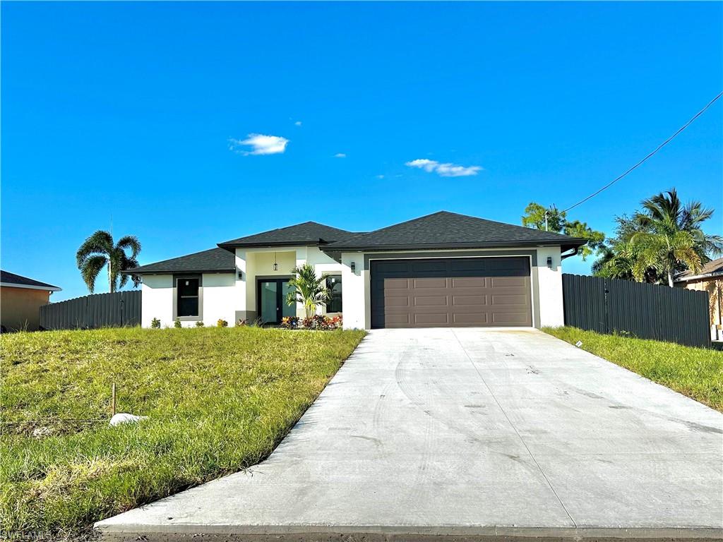 Welcome to your dream home in Northwest Cape Coral! This beautiful 3-bedroom plus den, 2-bathroom residence boasts modern comforts and premium finishes throughout. The sleek kitchen and elegant bathrooms feature quartz countertops and soft-closing cabinetry. Enjoy peace of mind with impact-resistant windows and doors, plus a builder warranty. Additional interior highlights include luxury tile showers with glass doors and a dedicated laundry area complete with a washer, dryer, and utility tub. Outside, the property shines with LED exterior lighting, an automatic irrigation system, and a fully fenced backyard with plenty of room for a pool. Don't miss the chance to make this perfect Cape Coral oasis your own!