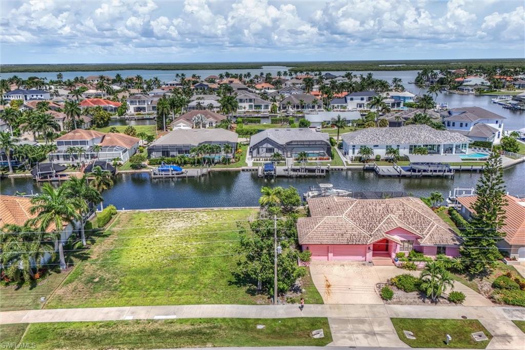 273 and 269 North Barfield Here it is: the listing builders wait years for and almost never see. Two contiguous parcels on Marco Island, offered together, delivering 200 feet of direct, unbroken waterfront frontage. Not a subdivided lot with a shared easement. Two full 100-foot waterfront frontages, side by side, sold as one. Offered together: $3,400,000 One parcel carries an existing home, sold AS-IS and ripe for a major rehab or a clean teardown. The other is vacant and ready to build. Together they let a builder do what almost never happens on this island anymore: construct two custom waterfront homes back to back, sharing site work and mobilization costs from day one. The high-visibility site also works well for a builder's model home. At roughly $17,000 per foot of combined waterfront, the economics are built in. One mobilization, two builds. One permitting cycle, two waterfront homes. The terms: This is an estate sale, handled by a trustee. The properties will not be separated. One transaction, one buyer, both parcels. Contiguous 200-foot waterfront assemblages don't come up on Marco Island. This one won't sit long.