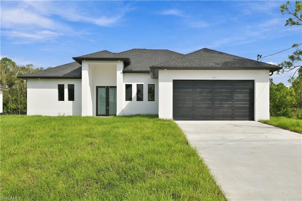 Welcome to this beautifully designed new construction home offering the perfect blend of modern elegance, comfort, and functionality! Featuring 3 bedrooms plus a den, soaring ceilings, and elegant 8-foot doors, this home offers a bright, open, and spacious layout. The upgraded kitchen showcases stunning quartz countertops, complemented by stylish finishes throughout. An electric fireplace adds a warm, inviting touch to the living area, creating the perfect space to relax or entertain. Step outside to the patio, already equipped with water hookups and ready for your custom outdoor grilling and entertaining setup! Backing up to a canal, the property offers a peaceful waterfront backdrop and added privacy with no immediate rear neighbors. Additional features include hurricane-impact windows and numerous upgrades throughout. Situated on a spacious quarter-acre lot in a peaceful neighborhood near State Road 82, this home provides convenient access to shopping, dining, downtown Fort Myers, and Southwest Florida's beautiful beaches. Move-in ready and loaded with upgrades, this is one you don't want to miss!