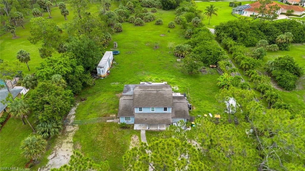 Over 2 acres of land to build your dream home! Excellent location West of Collier Blvd, between Pine Ridge & Vanderbilt Beach Rd. Being offered for lot value only and no value is given to the house currently on the property. No HOA fees, close to 75, shopping and dining and all that Naples has to offer!