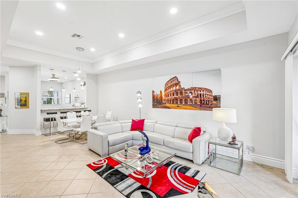 Don’t miss this incredible opportunity to own an exquisitely appointed villa that delivers the perfect blend of value, luxury, and the unbeatable Naples lifestyle you are searching for! This must-see 3-bedroom, 2-bath villa with a 2-car garage and & storage offers carefree Florida living in a gated communities.
From the moment you step inside, you’ll appreciate the light, bright, open-concept design featuring tile flooring in the main living areas, luxury vinyl flooring in the bedrooms, elegant tray ceilings, and oversized sliding glass doors that seamlessly connect indoor and outdoor living. The private screened lanai overlooks a peaceful landscaped area. The perfect setting for morning coffee or evening wine.
The spacious primary suite feels like a luxury hotel retreat with a sitting area, tray ceiling, two walk-in closets, and a stunning spa-inspired bath with an oversized walk-in shower. The flexible third bedroom easily adapts to your lifestyle as a home office, media room, hobby space, or guest room.
The chef’s kitchen is filled with natural light and designed for both entertaining and everyday living. Plus, you will love the added peace of mind that comes with impact windows and a newer tile roof only 4 years old.
Best of all, the association dues paid quarterly cover almost everything, creating a truly low-maintenance lifestyle: exterior maintenance, roof, water, sewer, exterior insurance, landscaping, cable, internet, clubhouse amenities, gated entry, and more. 
Residents enjoy resort-style amenities including a beautifully clubhouse, updated fitness center, heated/chilled pool, tennis and pickleball courts, library, and endless social activities.
Located just minutes from Downtown Naples, world-class dining, shopping, and the white sand beaches. This is the Florida lifestyle you’ve been waiting for at an exceptional value.