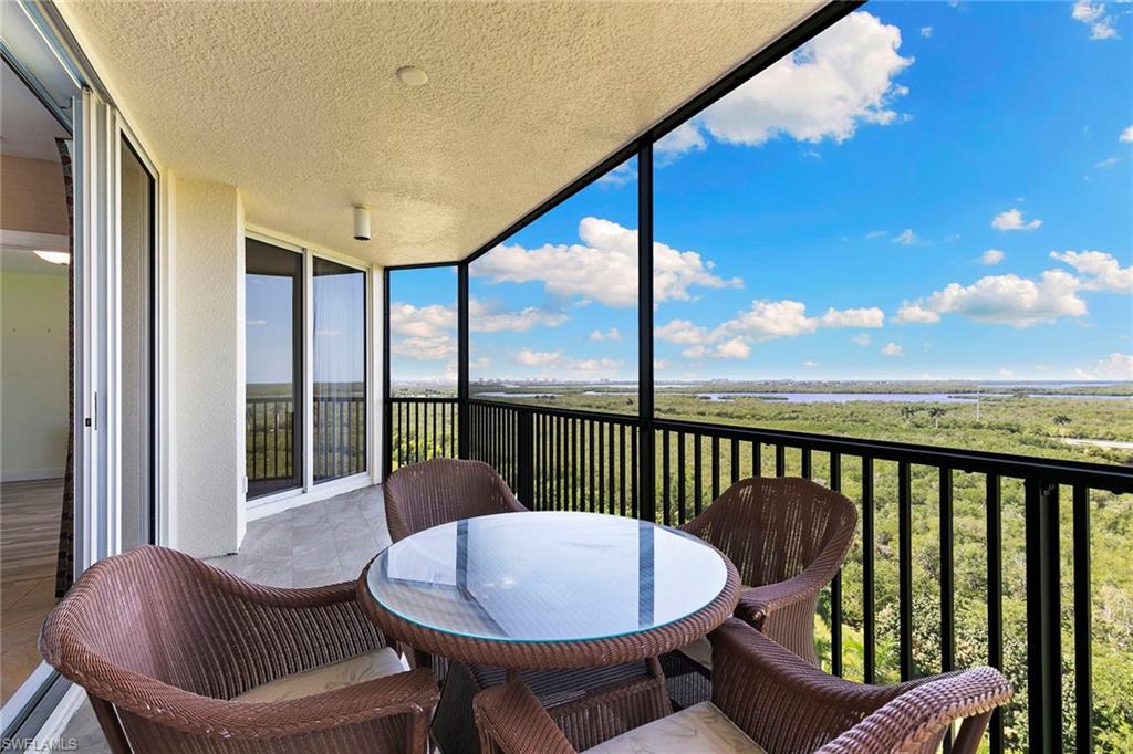 This spacious 10th-floor, three-bedroom, two-bath condo offers direct elevator access into the residence. Relax on the screened lanai and enjoy sunsets overlooking lush landscaping, natural preserves, and the bay. The lanai is accessible from the living room, primary bedroom, and one guest bedroom. The well-appointed kitchen features granite countertops, stainless steel appliances, and custom cabinetry. The primary suite includes a walk-in closet and a bathroom with a separate tub and shower. Additional conveniences include a dedicated laundry room with a washer and dryer, one assigned parking space, and extra storage. Residents enjoy first-class amenities within the building, including a pool, barbecue area, spa, theater, state-of-the-art fitness center, social room with billiards, elegant gathering spaces, and a beautiful lobby. Located in the gated Hammock Bay community, the property is ideally situated between Marco Island and downtown Naples’ Fifth Avenue, just minutes from world-class dining, shopping, and pristine beaches.