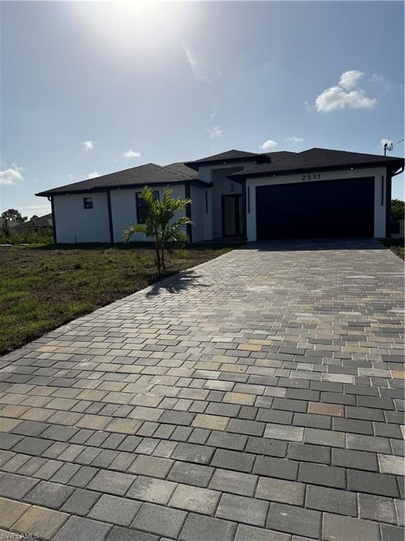 MOTIVATE SELLER. This Beautiful New Construction- 3/2 bath. Some features that makes this home unique are the 32 X 32 porcelain tile,8 ft doors throughout, 10 ft tray ceiling with fans, IMPACT RESISTANT windows & doors, lanai floors and exterior kitchen fully screened and matte black fixture. As you walk into the Kitchen you will notice the beautiful quartz countertops, soft close kitchen cabinets, Stainless steel appliances,LED lighting throughout the home. The house is in a quite neighborhood that is proximity to schools, grocery stores, fire station, hospital and close to Lee Blvd and SR 82. You won’t be disappointed, Won’t last long! Must come and see this property. We offer Closing Incentives.
