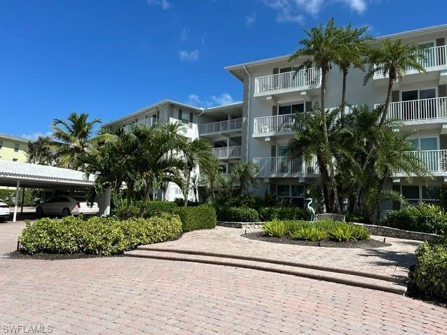 Discover your dream waterfront lifestyle in this pied a terre meticulously renovated with a stunning view of Mooring's Bay. This first floor gem is perfect for avid boaters and beach lovers. Wake up to breathtaking sunrises and the sights of dolphins, manatees, and pelicans at play in your backyard. Ground floor open living area oriented directly onto the mesmerizing bay waters. Totally maintenance free lifestyle.