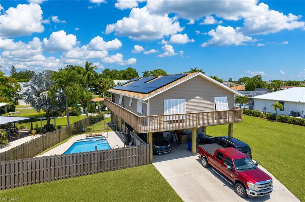 Enjoy the best of Florida waterfront living in this canal-front pool home located in the desirable Fort Myers Shores community. This 3-bedroom, 2-bath residence offers over 1,500 sq ft of living space with a bright, open layout designed for both everyday comfort and entertaining.

A standout feature is the one bedroom one bath with kitchen private first-floor guest suite, ideal for extended family, visitors, or potential rental income—offering flexibility that today’s buyers are actively seeking.
Step outside to your own backyard retreat featuring a screened uper deck, pool/spa, and tranquil canal views—perfect for relaxing evenings or hosting guests. With direct waterfront access, this property is a great fit for boating enthusiasts and those looking to embrace the Southwest Florida lifestyle.

Situated on a generously sized lot with no HOA, this home provides convenience, freedom, and strong upside potential. Seller will Pay off solar panels at closing.  Whether you're searching for a primary residence, seasonal getaway, this property checks all the boxes.