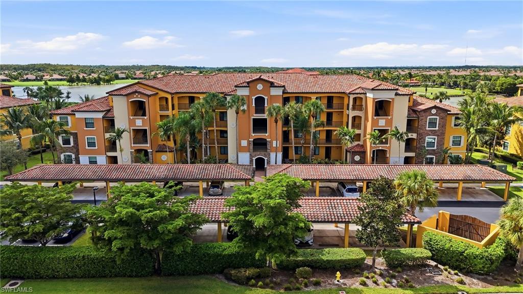 One or more photo(s) has been virtually staged, AI generated or rendered.  xperience elevated resort-style living at Bonita National Golf & Country Club. This beautifully upgraded, second-floor Bellini model condominium offers two bedrooms, two bathrooms, a coveted full golf membership, and spectacular sunset views overlooking the lake and championship golf course.

Thoughtfully enhanced with approximately $20,000 in improvements, this light-filled residence features fresh interior paint, custom-designed closets, elegant crystal lighting, updated kitchen and bathroom fixtures, and lanai sunshades. The spacious primary suite is a private retreat, featuring generous custom walk-in closet and beautiful lake and golf course views. Hurricane-impact windows and doors throughout provide added peace of mind, while the open-concept living area flows seamlessly to a screened lanai—an inviting setting for morning coffee or evening sunsets.

Beyond the residence, Bonita National offers an exceptional collection of resort-style amenities, including an 18-hole Gordon Lewis-designed championship golf course, spectacular resort and lap pools, Har-Tru tennis courts, a full-service spa, fitness center, clubhouse dining, and poolside cabana bar.

Whether seeking a seasonal retreat or a full-time Florida residence, this meticulously maintained condominium offers an outstanding opportunity to enjoy the sophisticated, active lifestyle of one of Southwest Florida's premier bundled golf communities.