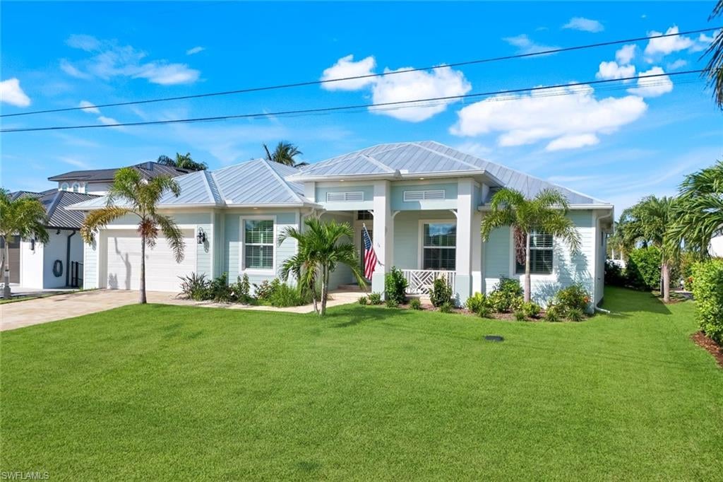 Located in one of the fastest growing and most desirable neighborhoods in the NW Cape, this Custom Coastal Masterpiece is sure to please even the most discerning buyer. This is not your typical “cookie cutter” floor plan, as this home not only offers 4 Bedrooms & 2 Full Baths in the main house, but it also offers a completely private Detached Guest Quarters with 1 Bedroom and 1 Additional Bath that is accessible from the outside pool area. This space would be ideal as a Mother-in-Law Suite, a Private Home Office, a Game Room or Fitness Studio, or even a Poolside Cabana Bar for Outdoor Entertaining. With just under 3,000 square feet of air-conditioned living space, there is plenty of room for a large family or for entertaining guests. Features include Custom Wood Cabinetry, Quartz Countertops, High-End Stainless-Steel Appliances including a Gas Range and a Wine Chiller, Decorative Tray Ceilings with Crown Molding & Accent Lighting, Gorgeous Kitchen & Bath Tile, Upgraded Plumbing & Light Fixtures, 90 Degree Disappearing Corner Sliding Glass Doors, Impact Resistant Windows & Doors, and SO MUCH MORE! The features are truly too numerous to list! Outside you’ll find a MASSIVE Covered Lanai with two private spaces that allow for an Outdoor Dining Area as well as an Outdoor Living Area. Beyond that you will find the Sparkling Heated Pool, Brick Paver Deck, and a Picture Window Screen Enclosure that provides stunning water views of the Micanopy Canal. Enjoy Quick Gulf Access to some of the best boating, fishing, and waterfront dining destinations on the SW Gulf Coast! This home is in close proximity and a short walking distance to the 7 Islands Development Project that will bring a vibrant atmosphere to the community, along with restaurants, shopping, and recreational facilities. This home is on city water and sewer, and ALL ASSESSMENTS ARE PAID IN FULL! This home had NO flooding during Hurricanes Ian, Milton, & Helene. The seller also has an ASSUMABLE VA LOAN with a fixed interest rate of 3.5% that the seller is offering to any qualified Veterans. This home is easy to show and priced to sell. Don’t let this one slip away! Secure your “Piece of Paradise” today!