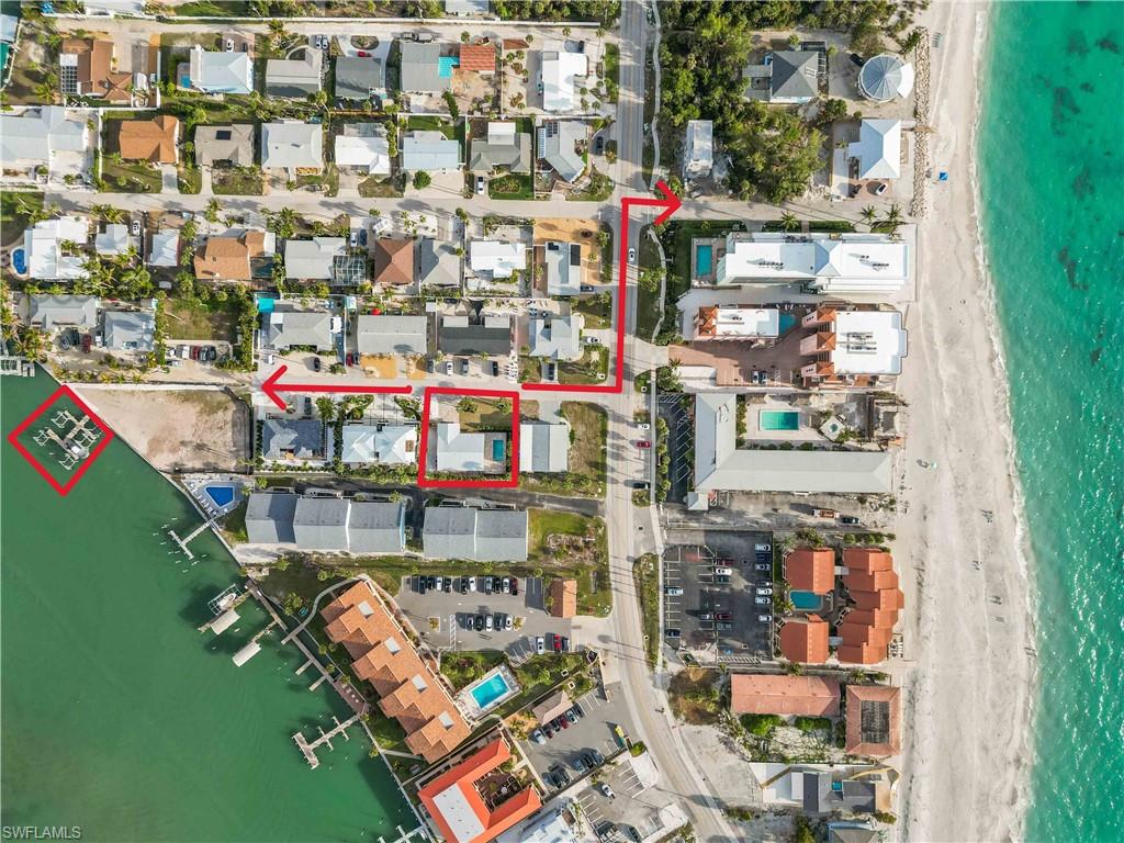 This is your opportunity to own what is believed to be the ONLY home on the market located on the south end of Manasota Key offering the highly coveted combination of DEEDED BEACH ACCESS, TWO PRIVATE BOAT LIFTS, and a BRAND-NEW HEATED & COOLED SWIMMING POOL. Perfectly positioned on the popular south end of the Key, you'll enjoy walking distance to restaurants, bars, live entertainment, shopping, and the beach, making this one of the most desirable locations on the island. Whether you're searching for a luxury vacation retreat, a high-performing short-term rental investment, or a full-time waterfront residence, this property offers unmatched versatility. Located in one of Manasota Key's most sought-after vacation rental areas, the home benefits from NO HOA and NO RENTAL RESTRICTIONS, allowing owners the flexibility to maximize rental income while still enjoying the property whenever they choose. Recently reimagined from the ground up and now professionally furnished and decorated, this stunning coastal home is truly move-in ready. The thoughtfully redesigned floor plan showcases luxury finishes throughout, including a designer kitchen with a large island, stone countertops, brand-new stainless-steel appliances, and spacious living areas designed for entertaining and relaxed island living. The split-bedroom layout offers privacy for owners and guests alike. The spacious primary suite features a luxurious bath with dual vanities and a walk-in shower, while two additional guest bedrooms and bathrooms provide comfortable accommodations for family and visitors. Step outside and experience your own private resort. The brand-new 24' x 12' heated and cooled swimming pool allows year-round enjoyment, while ambient lighting, shade sails, wrought iron fencing, and mature landscaping create an inviting outdoor oasis. Wiring is already in place for a future hot tub and cold plunge. Boaters will appreciate the deeded dock access on Lemon Bay featuring TWO PRIVATE BOAT LIFTS with water and electric service. From here, enjoy direct boating access to the Gulf with no fixed bridges. Just across the street, deeded beach access leads to a quieter stretch of Gulf shoreline where you can enjoy morning walks, shelling, and breathtaking sunsets. Major upgrades include impact windows and doors, metal roof, all-new electrical with 200-amp service, all-new plumbing, new HVAC system and ductwork, closed-cell spray foam insulation, new paver driveway and walkways, and a new irrigation system supplied by an on-site well. Opportunities like this are exceptionally rare. Finding a property with beach access, bay access, TWO boat lifts, a heated and cooled pool, no rental restrictions, and a walkable location in the heart of Manasota Key's most vibrant area is nearly impossible.