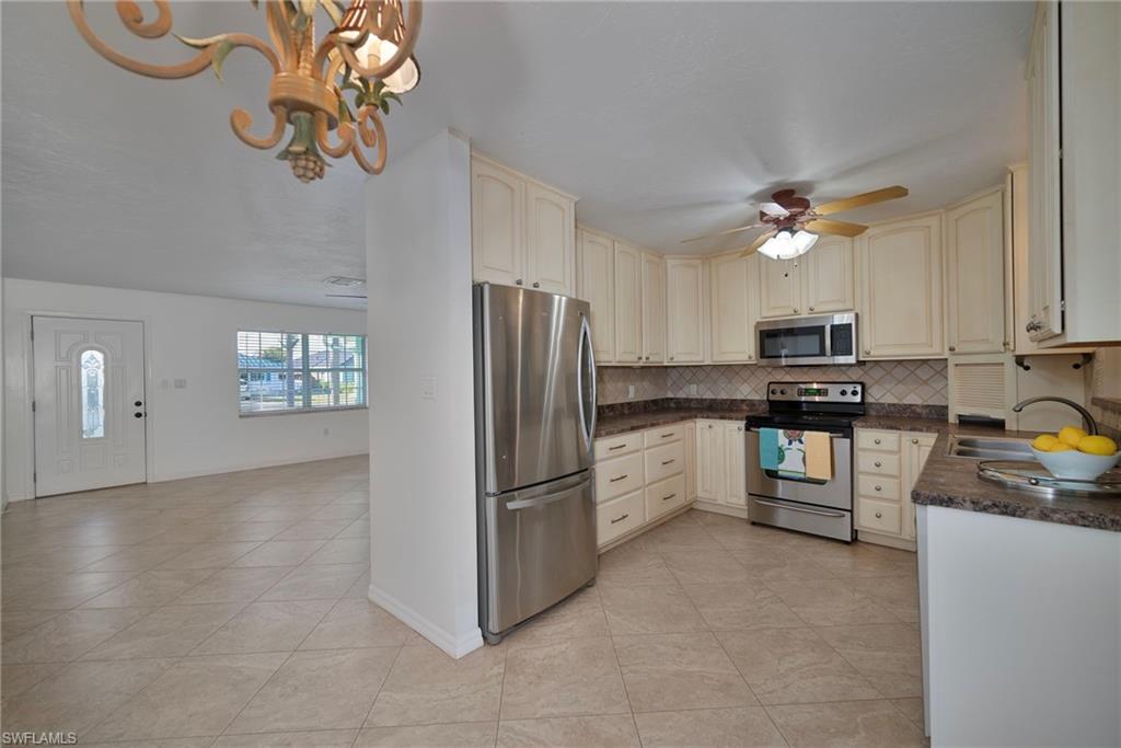 Looking for the perfect investment? This duplex sits on a large fenced in double lot, west of 41. Nestled on the 500 block in the desirable community of Naples Park, it is only a short 10 minute walk to the beautiful pure white sands of Vanderbilt Beach. Close to shopping, dining and entertainment in the lively Mercato, which underwent "recent updates", including extra public spaces and a stage for weekly outdoor entertainment. Your grocery shopping is only 5 min. away, with Whole Foods in Mercato, and Publix and Trader Joe's only a min. down the street. This 1,879 total sq ft duplex appears more like a single family home from the exterior. Each apartment has 2 bedrooms and one full bath, stainless steel appliances, their own designated AC, water heater, and laundry. Unit #565 has their washer and dryer in a cupboard on the screened in lanai. In 2005 impact windows were installed. There's plenty of parking, and an abundance of green space for a pool and/or entertaining. Either for an investment, or to vacation in one side while renting out the other, 565 100th Ave N is definitely worth a look.
