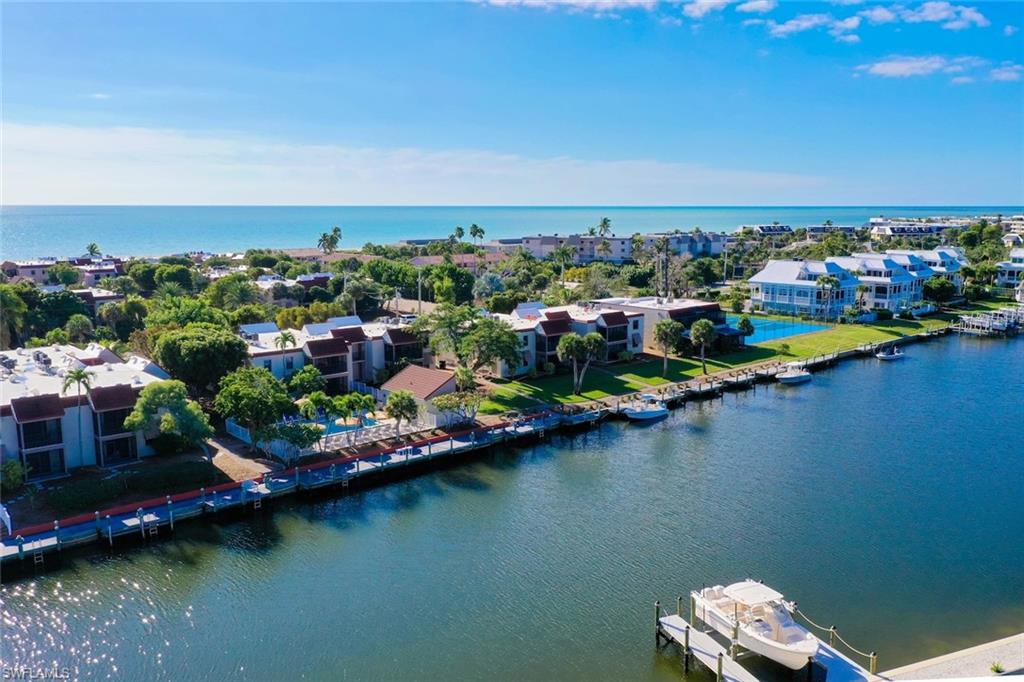 At Sanibel Moorings, you don’t have to choose between beach days and boating. This top-floor condo sits between the Gulf beach and a wide stretch of one of Sanibel’s canals, so you can start the morning with your toes in the sand and end the day on the water.

Inside, the 2-bedroom, 2-bath residence has been beautifully updated and is offered fully furnished. The open kitchen features brand-new stainless steel appliances and flows easily into the living area, so cooking and gathering happen in the same bright space. Both bedrooms are filled with natural light, fresh carpeting runs throughout, and a queen pullout sofa adds room for extra guests.

Sanibel Moorings is known for its lush, continually expanding gardens, which give the property its peaceful, tropical feel. Two community pools offer a choice of places to unwind, and the beach is just a short stroll away.

For investors, this unit is a strong rental candidate. Onsite rental management handles the details, making it easy to enjoy the property yourself while it earns income when you’re away.

Updated, furnished, and ready for its next owner, this is your chance to own a true Sanibel escape.
