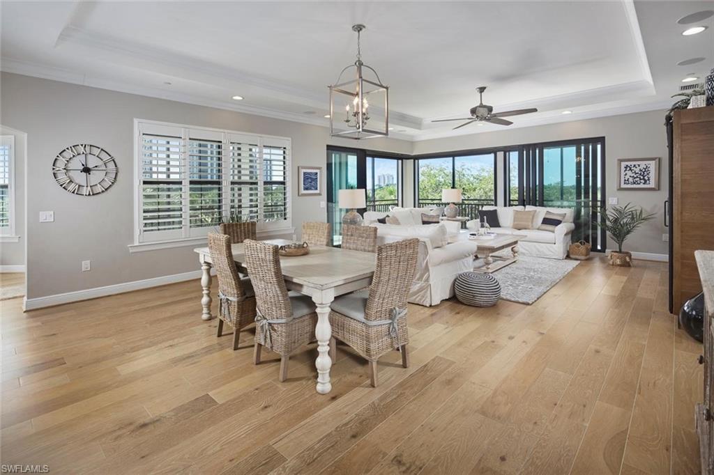 Discover an exceptional opportunity for refined coastal living in this beautifully appointed second-floor residence at Cielo in The Colony. Offering 3 bedrooms plus a den and 3.5 baths, this inviting home combines sophisticated design, spacious interiors, and picturesque views of the lake and golf course. An expansive terrace provides the perfect setting to enjoy peaceful mornings, afternoon breezes, and relaxing evenings surrounded by Southwest Florida's natural beauty. Inside, a thoughtfully designed open floor plan seamlessly connects the kitchen, living, and dining areas, creating an ideal space for both everyday comfort and effortless entertaining. The primary suite serves as a private retreat, featuring a spa-inspired bath and direct access to the lanai, where tranquil views provide a beautiful backdrop. Two generously proportioned guest bedrooms offer comfort and privacy, while the versatile den is ideal for a home office, media room, or additional gathering space. Elegant finishes, abundant natural light, and inviting living spaces enhance the residence's timeless appeal. Cielo offers the convenience of two garage parking spaces. Residents of The Colony enjoy an exceptional resort-inspired lifestyle, including membership to The Bay Club, access to a private beach park, tennis, pickleball, bocce, kayaking, canoeing, and sailing. Ideally situated just minutes from upscale shopping, fine dining, entertainment, world-renowned beaches, and Southwest Florida International Airport. Experience the perfect balance of luxury, comfort, and convenience in one of Southwest Florida's most desirable communities.